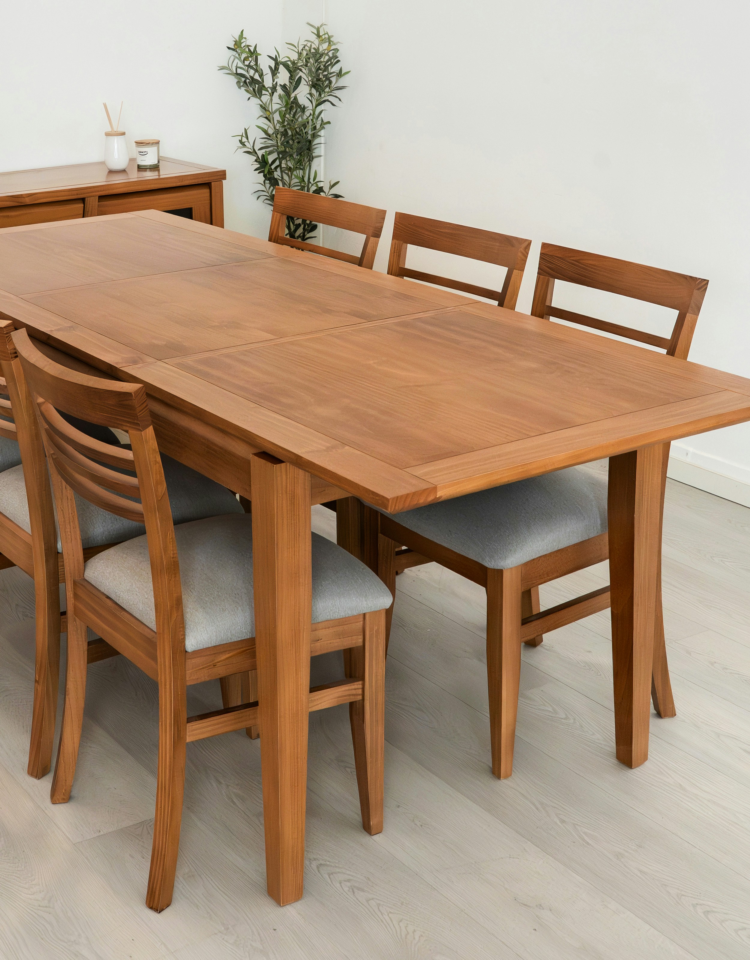 Wooden dining table with six upholstered chairs
