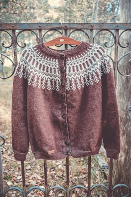 Brown knitted cardigan with white nordic pattern