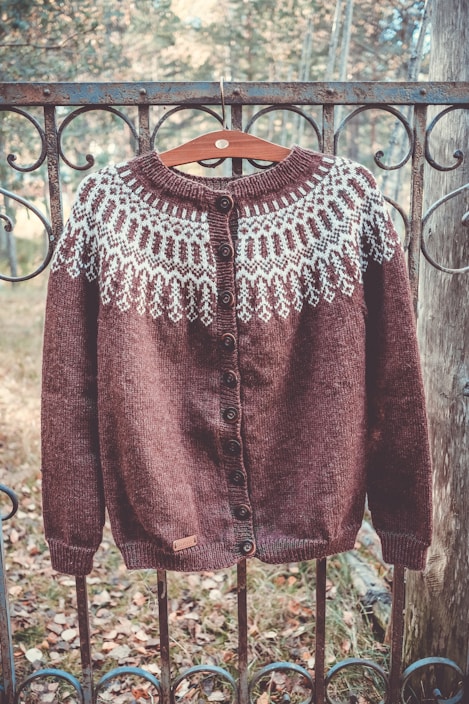 Brown knitted cardigan with white nordic pattern