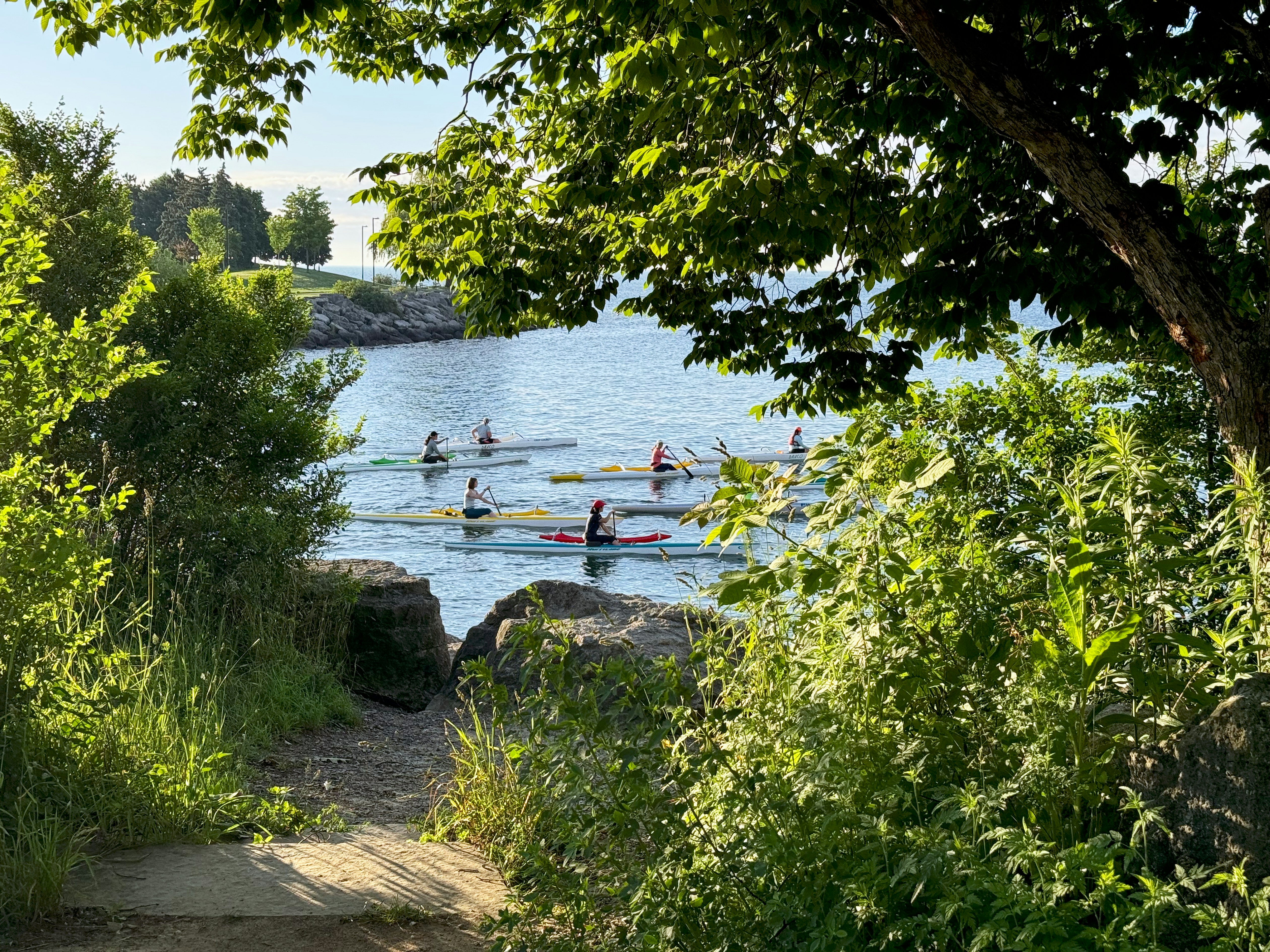 Kayakers paddling together on a calm lake