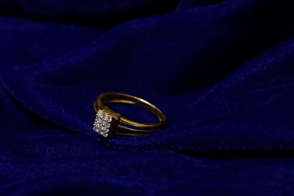 Gold ring with diamonds — fine designer jewelry evaluation at Astoria Gold Buyer Pawn Shop in Queens NYC