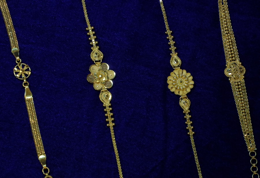 Delicate gold bracelets on blue velvet
