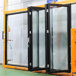 Modern black framed folding glass doors installed