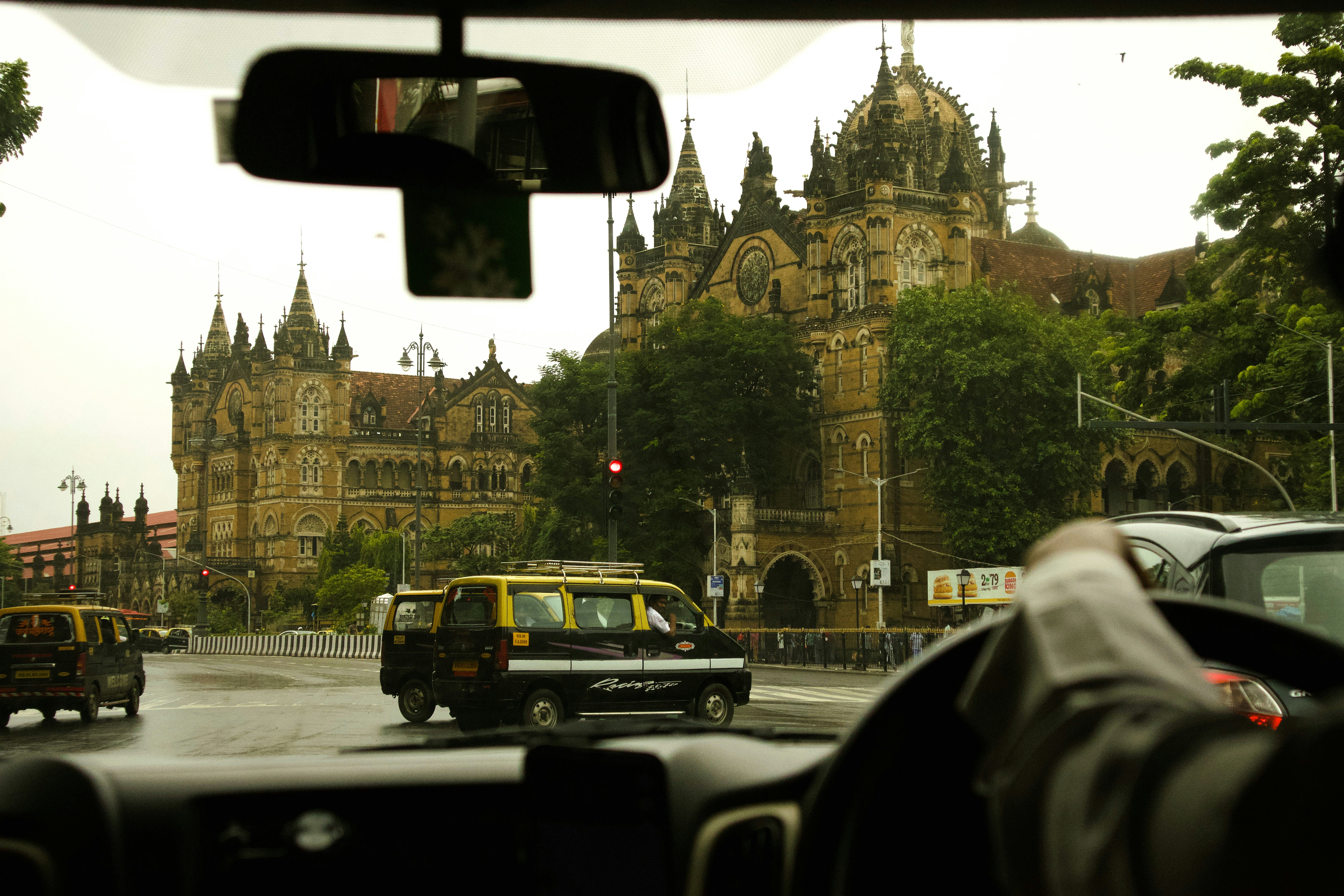 View of historic building from inside car