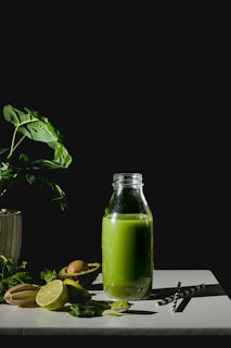 Green smoothie with avocado, lime, and spinach.