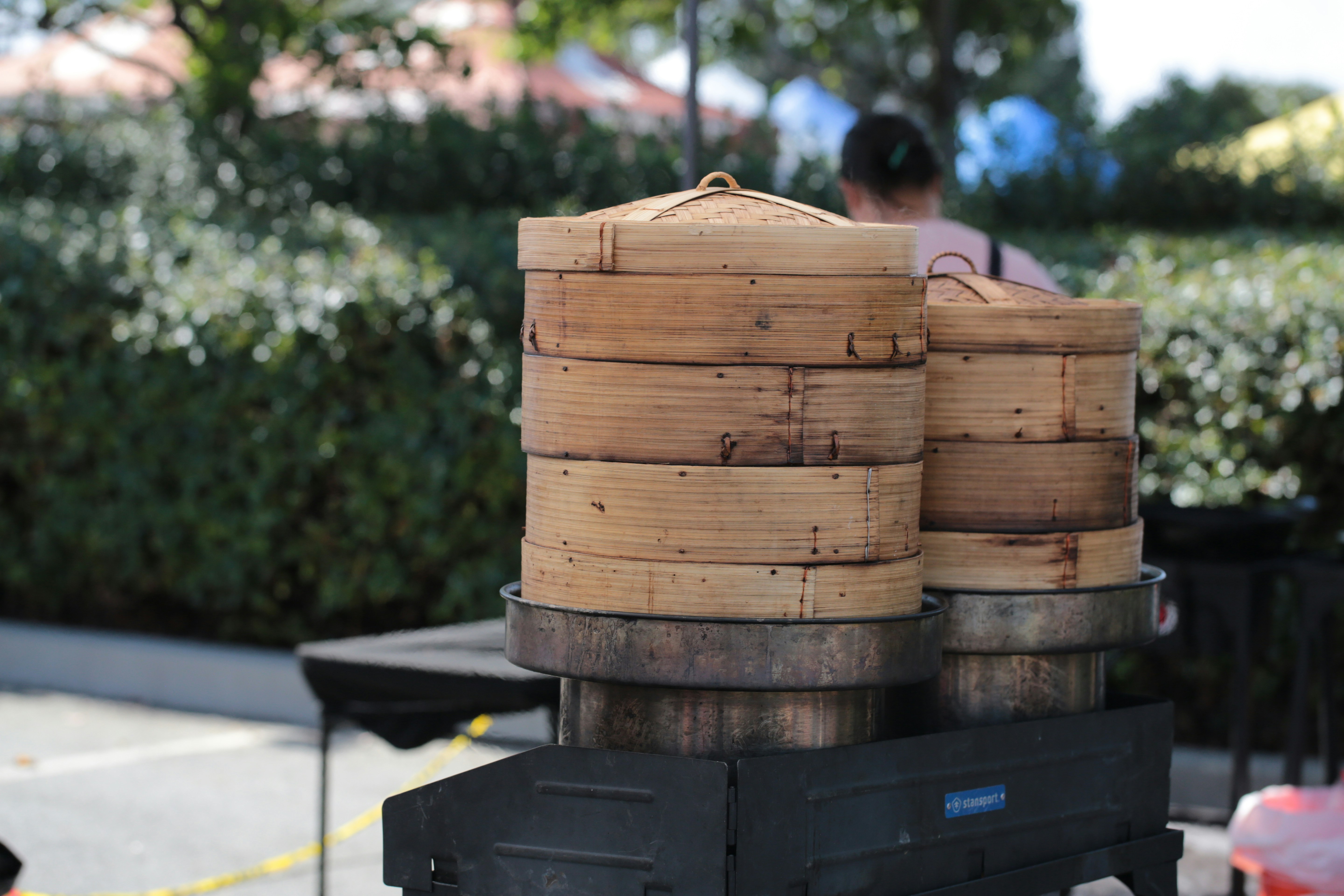Stacked bamboo steamers over a cooking pot