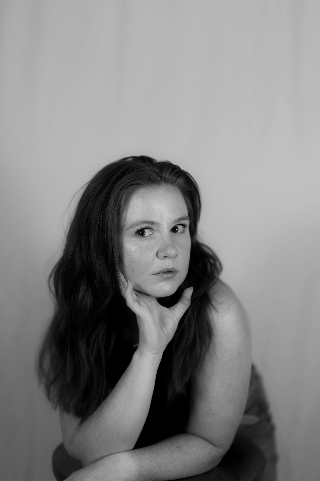 Woman touching her chin and lower face