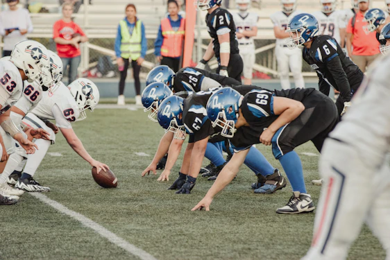 American football teams line up for a play.
