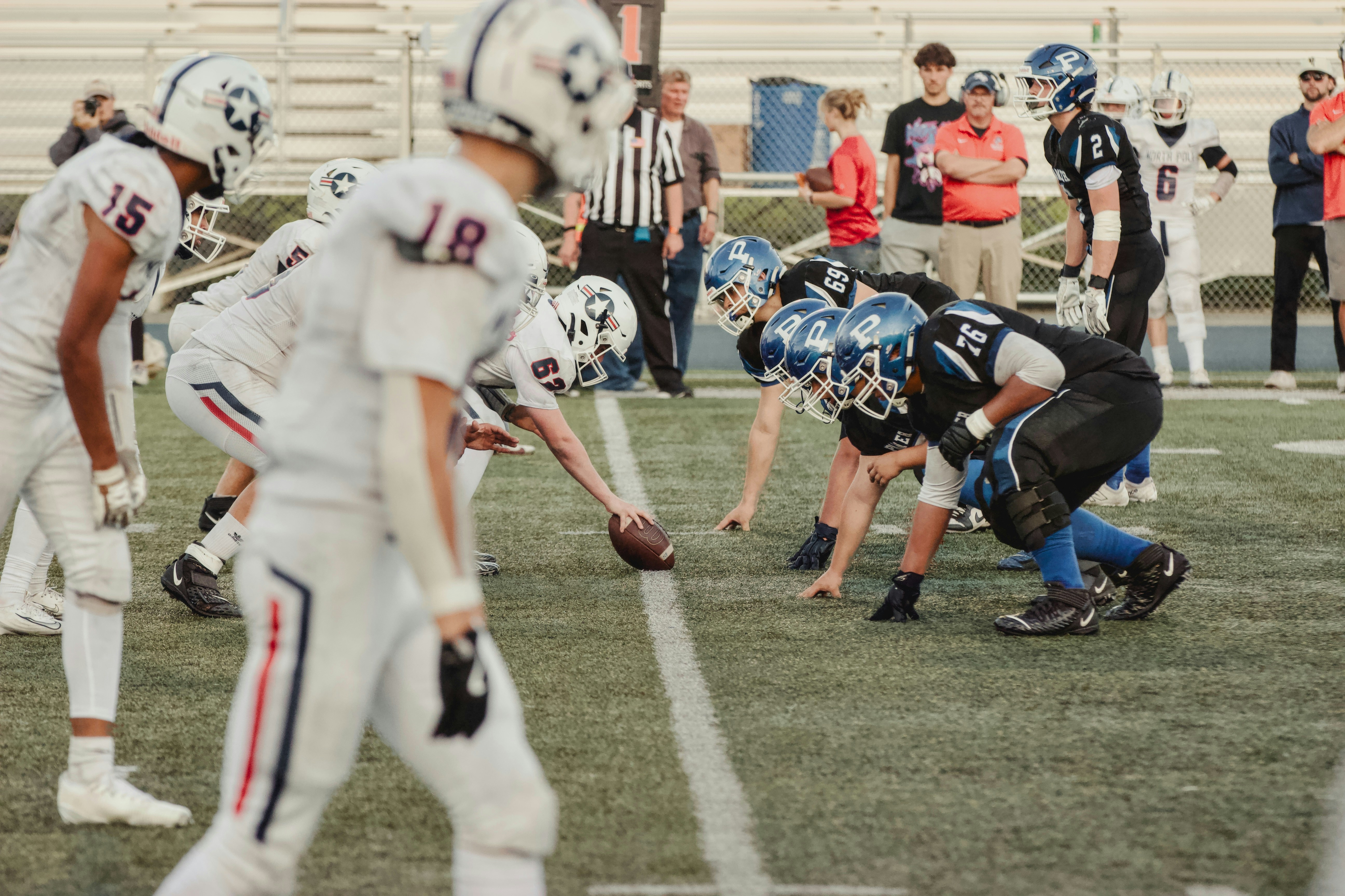 American football teams line up for a play.