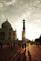 Taj mahal at sunset with people walking