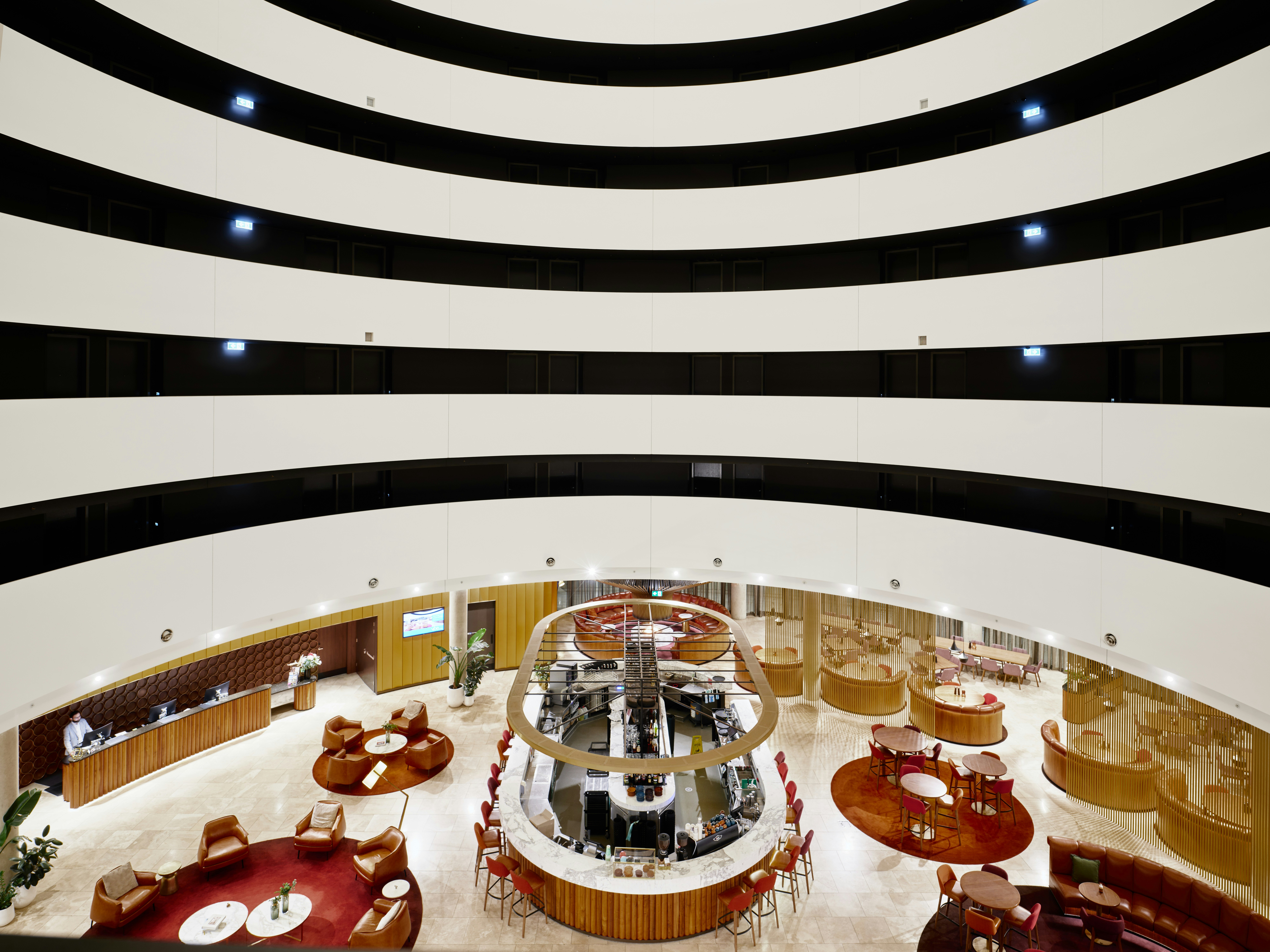 Modern interior with circular seating and atrium