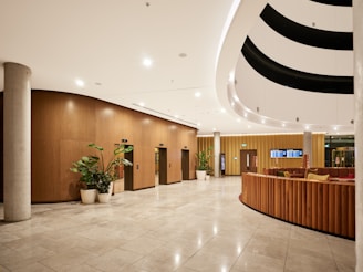 Modern hotel lobby with elevators and seating area