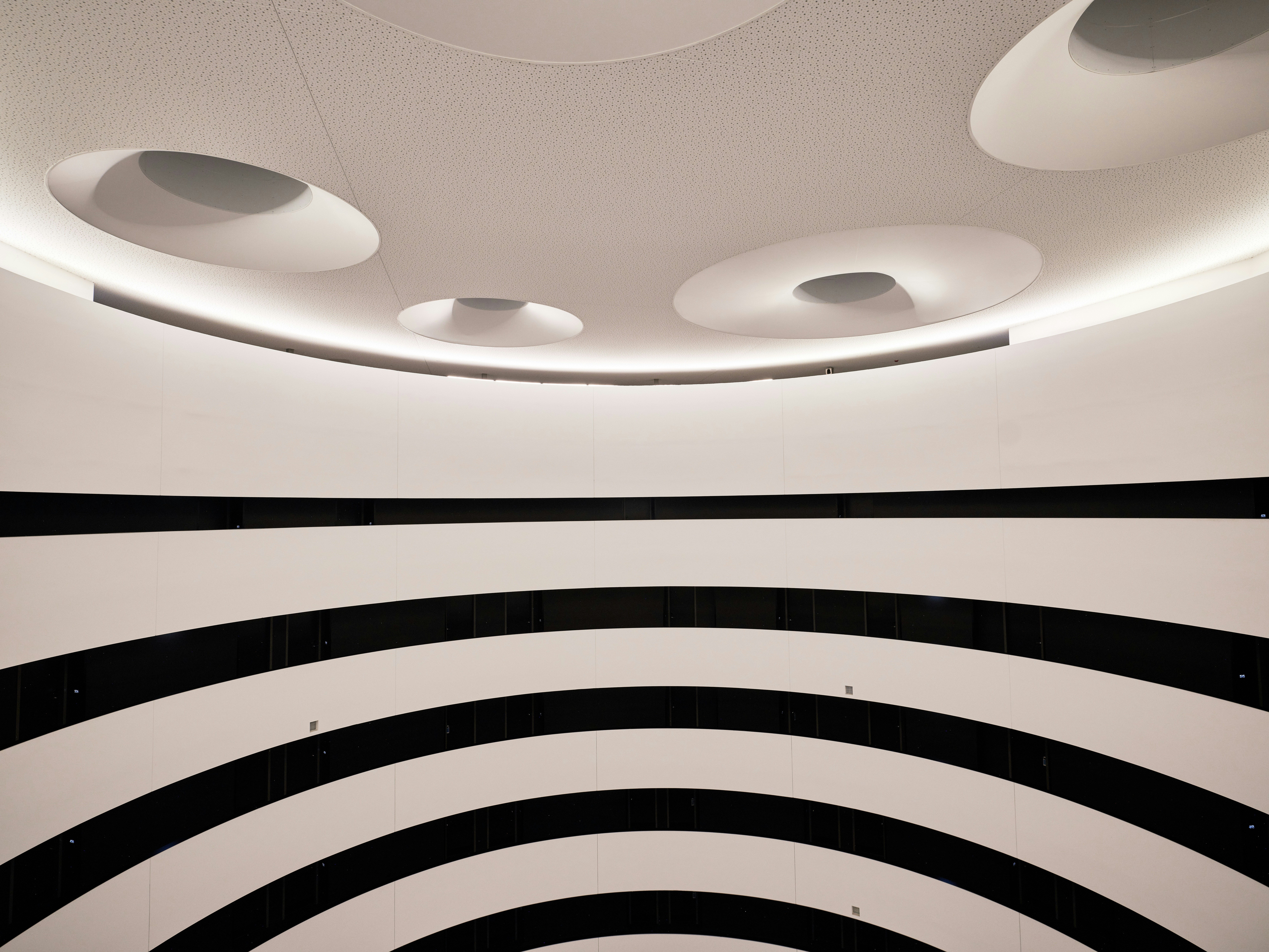 Modern white ceiling with black striped walls