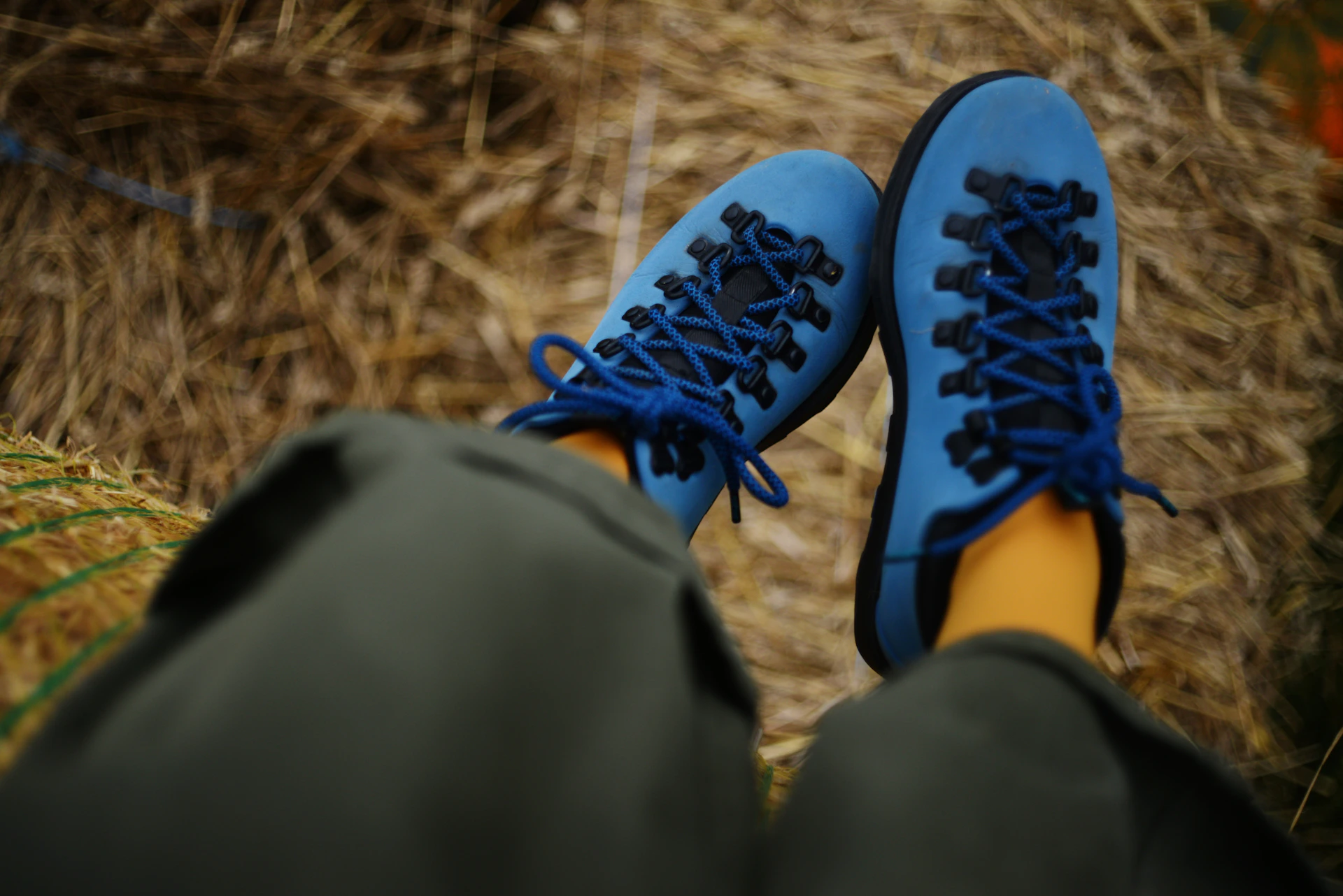 Pair of blue hiking boots with black laces.
