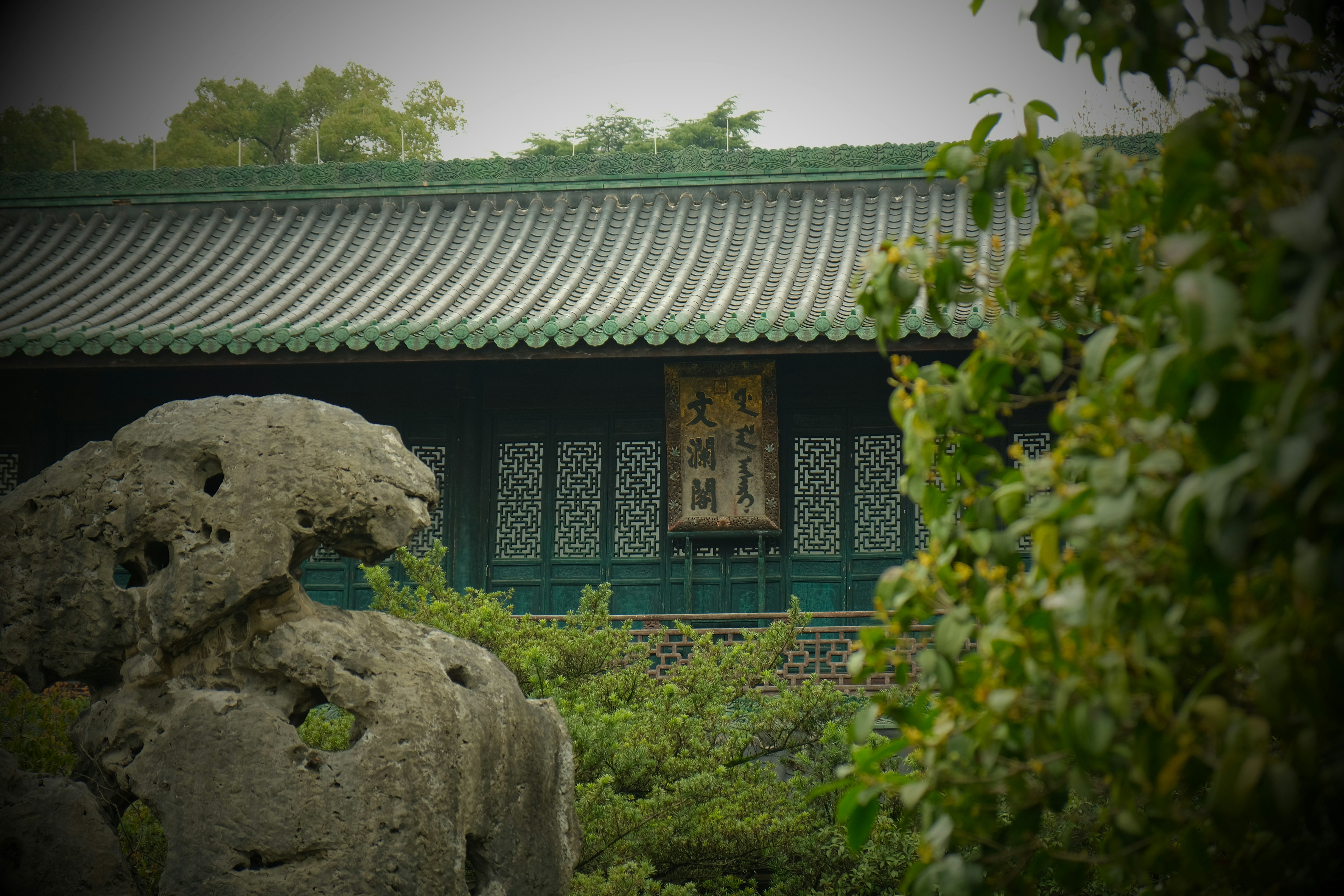 Traditional building with green roof and ornate windows