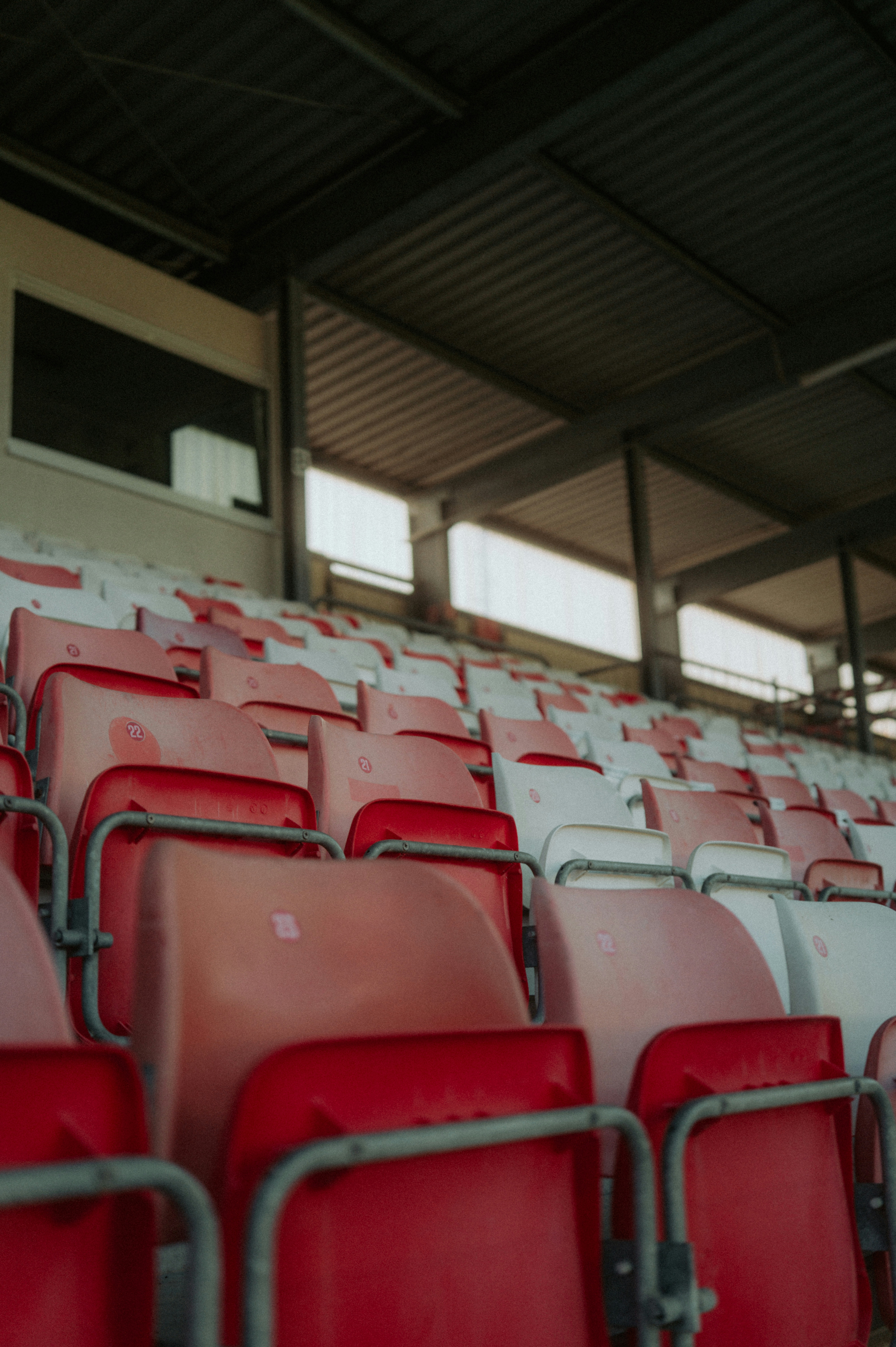Empty stadium seats in red and white