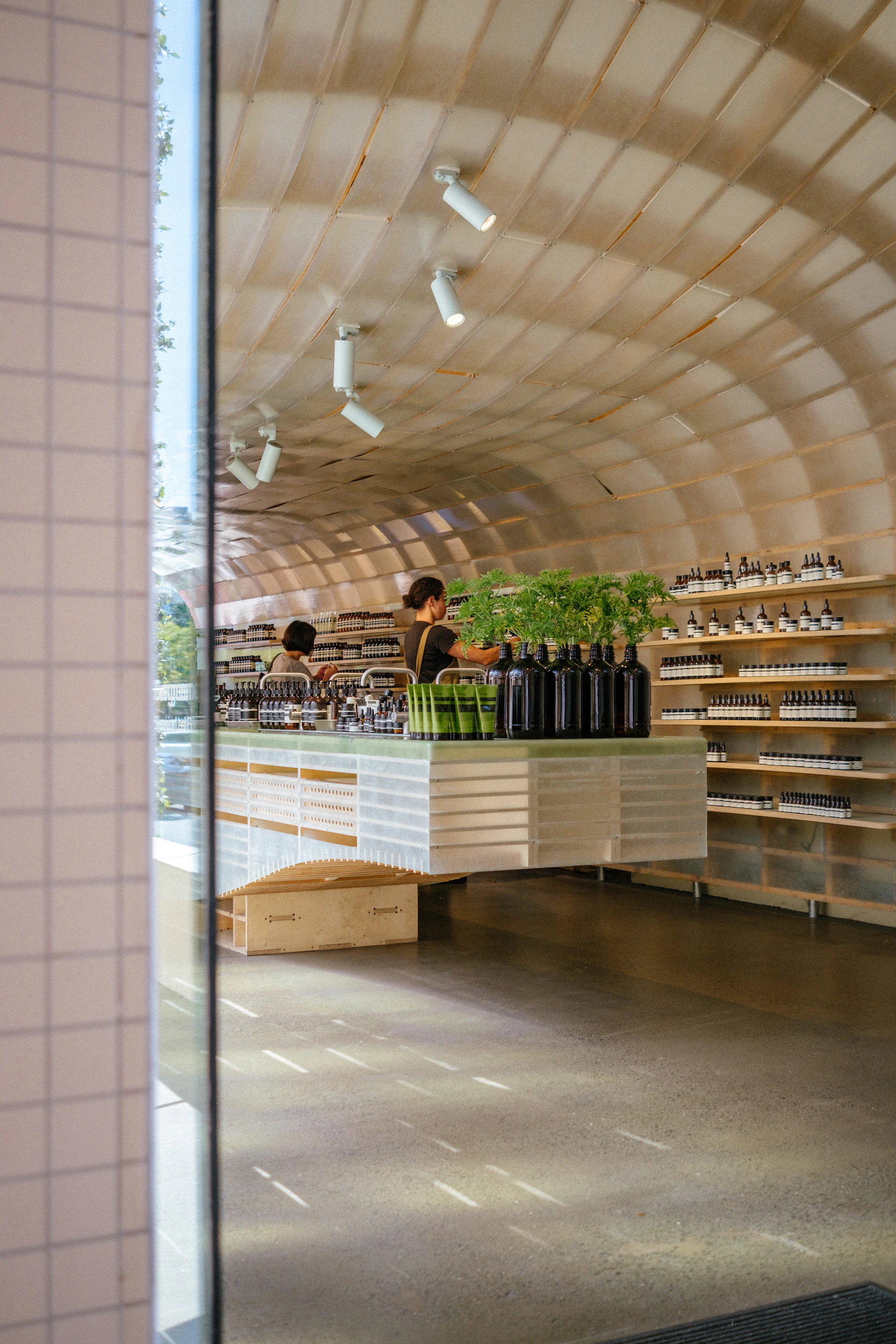 Modern commercial retail interior with architectural wooden arched ceiling fit-out
