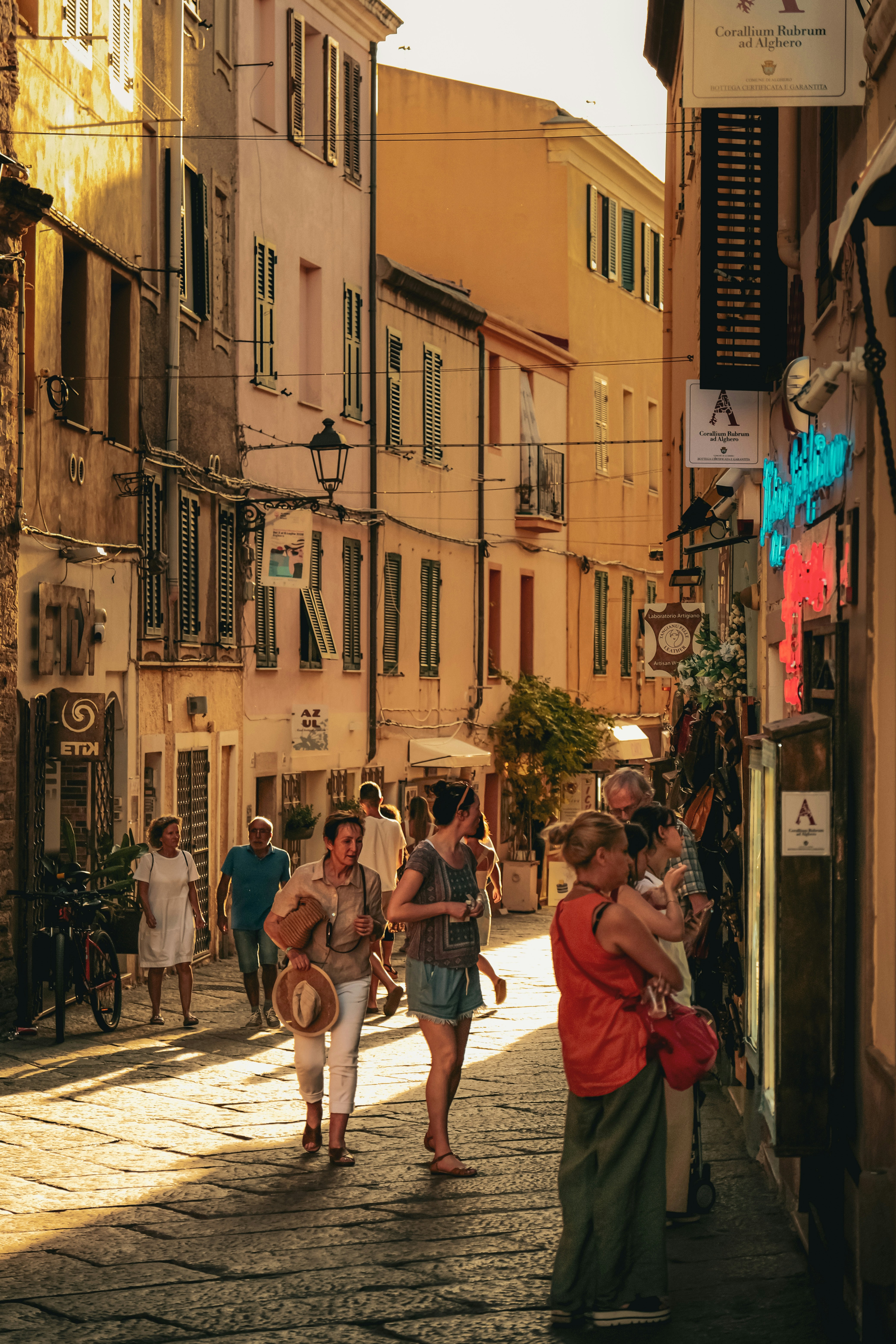 People strolling down a sunlit European street