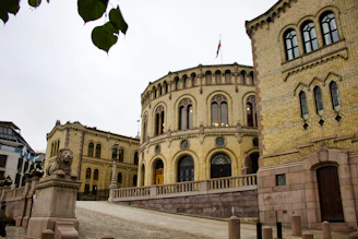 Ornate building with arched windows and yellow brick