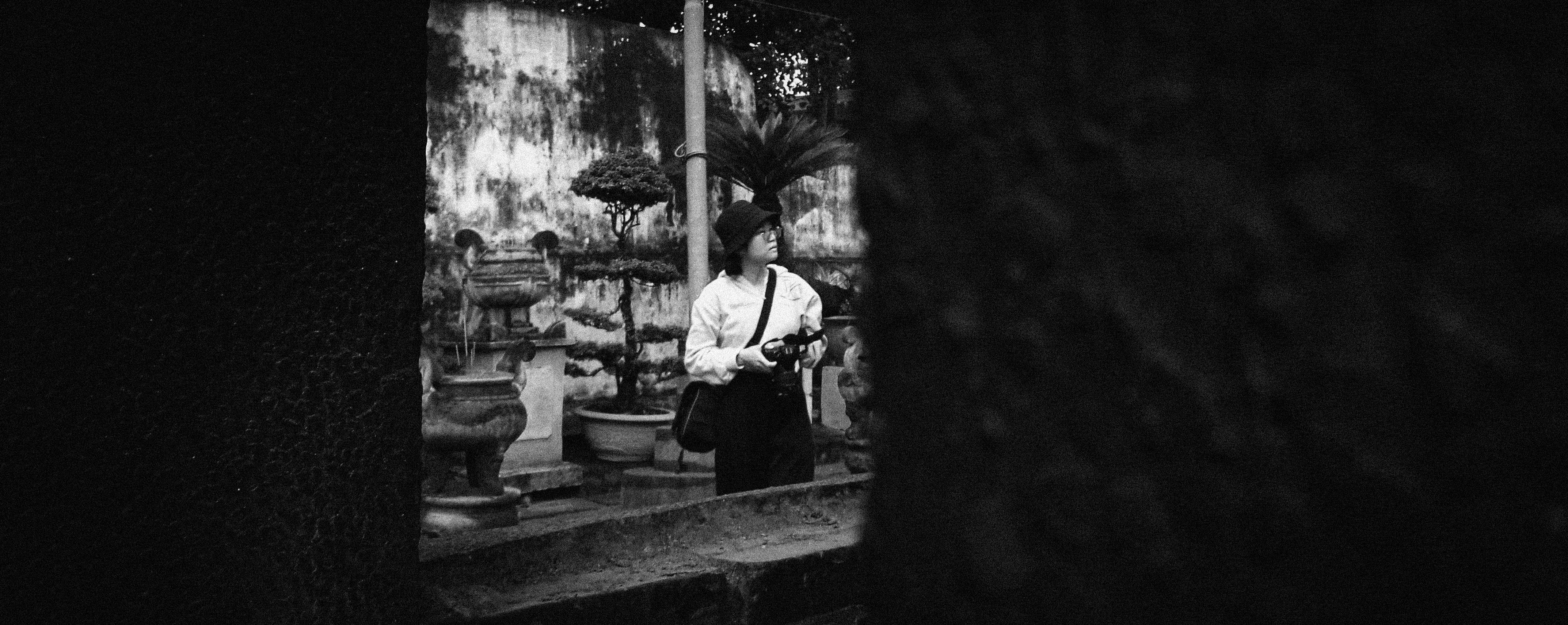 People gathered around a man holding a camera