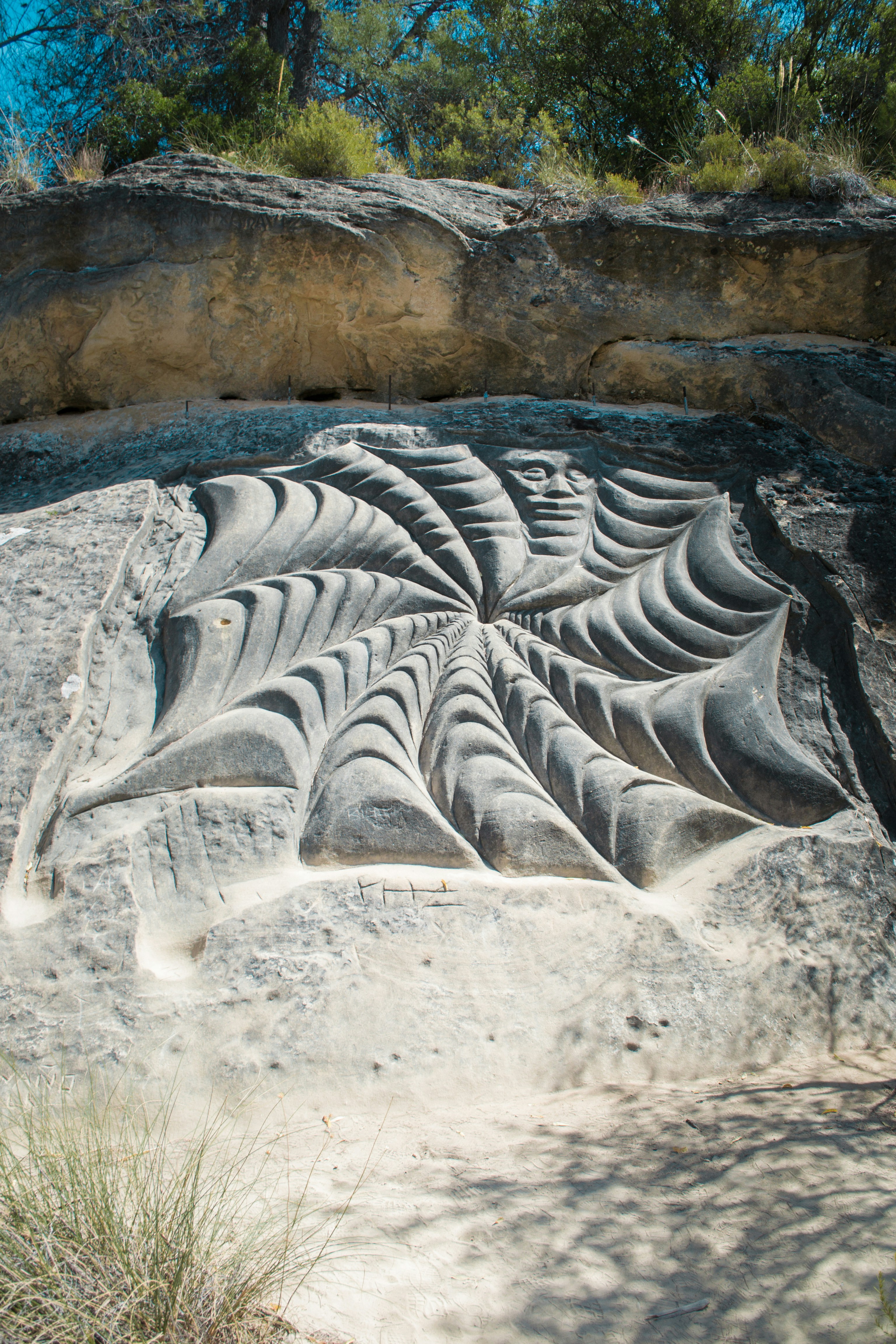 Carving of a face in a rock formation