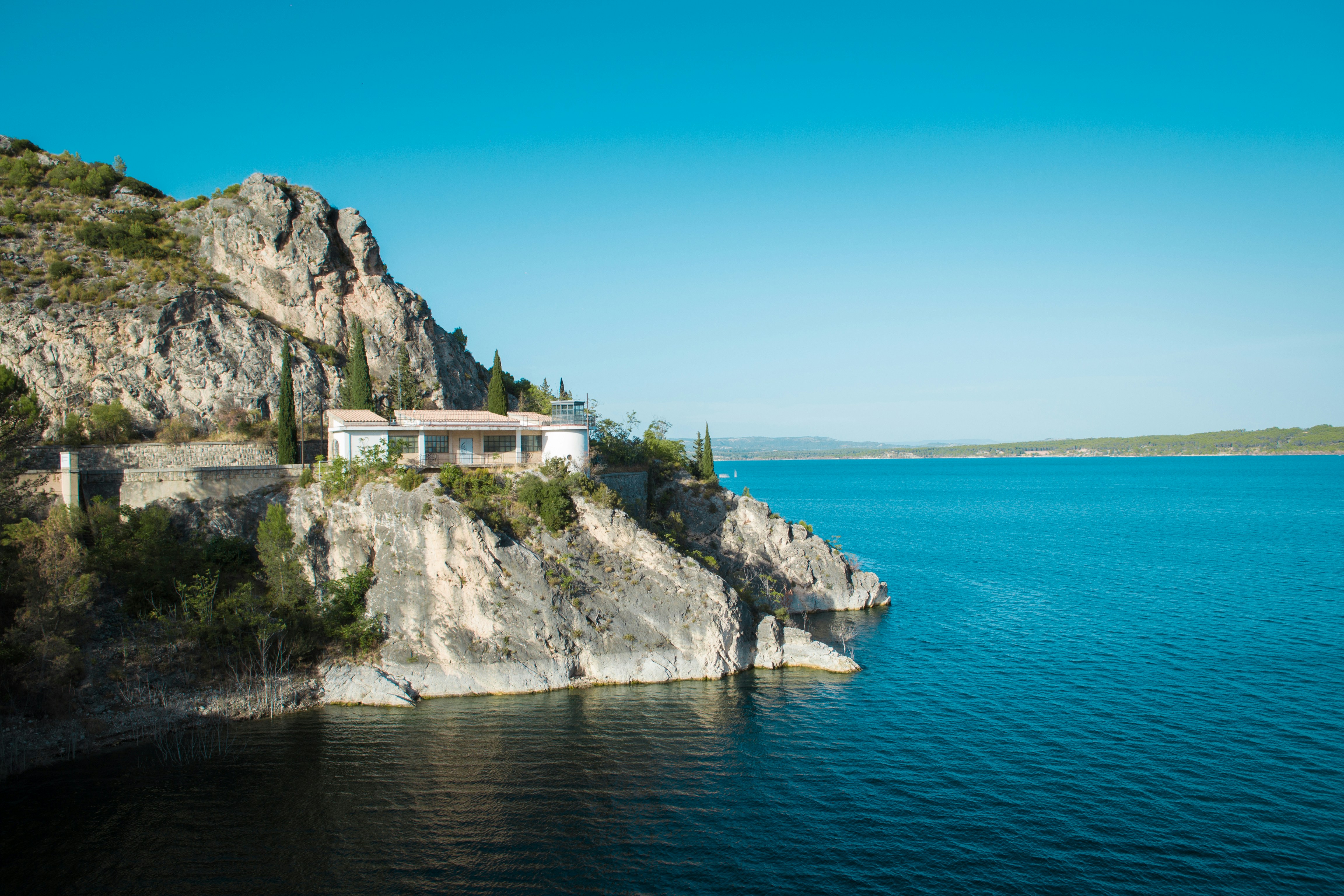 House on cliff overlooking lake