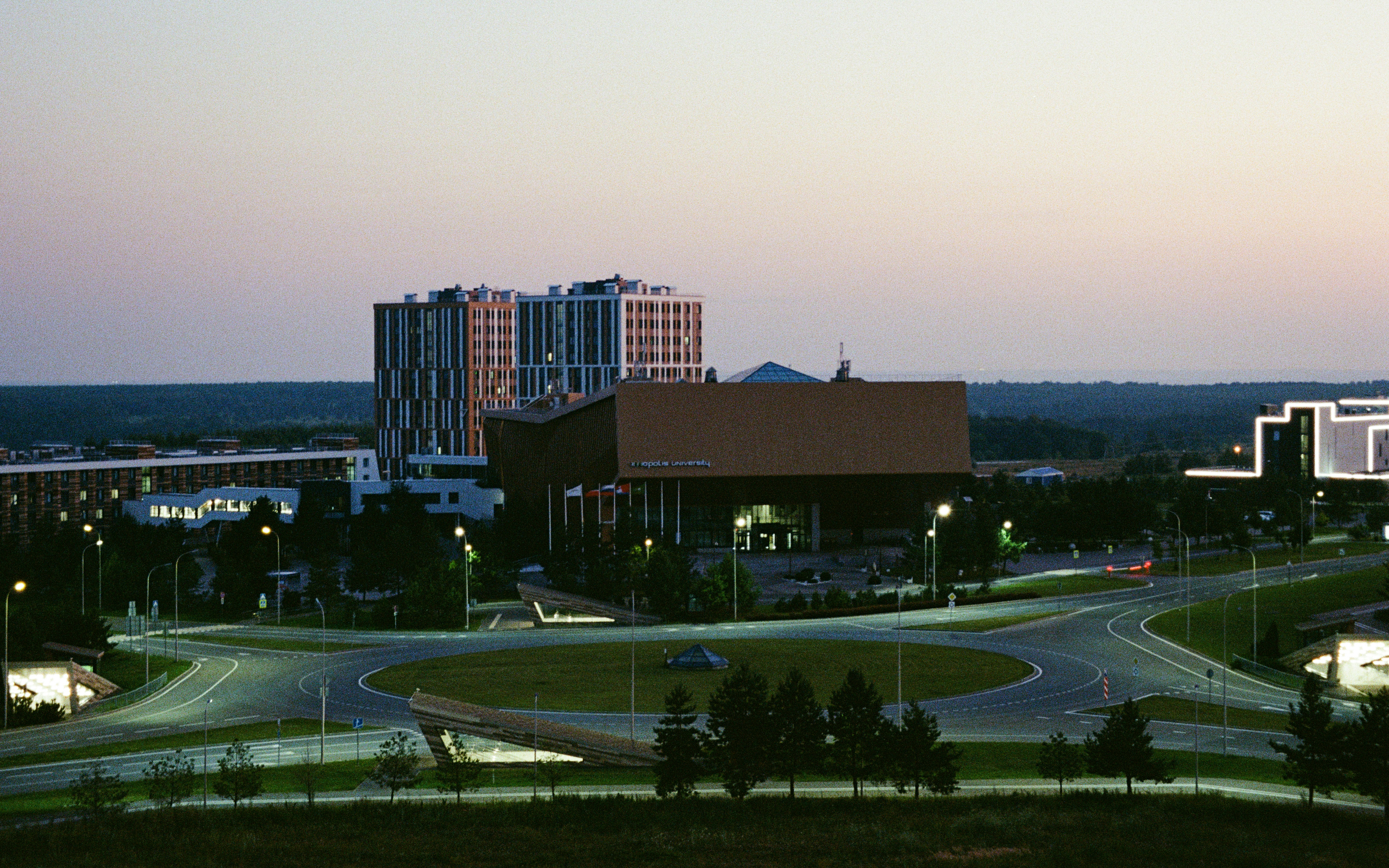 Modern buildings on a roundabout at dusk