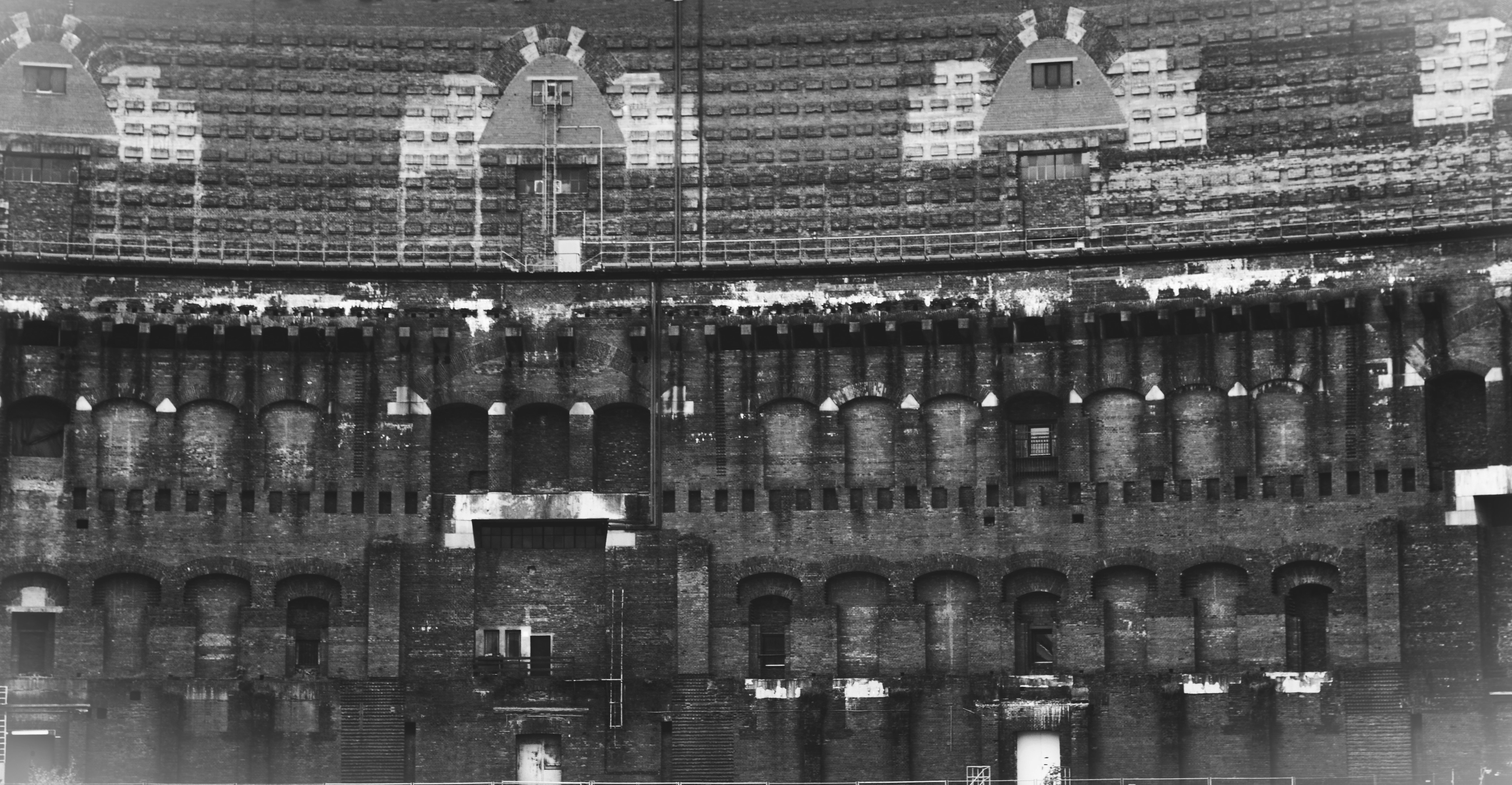 Old brick building with many arched windows