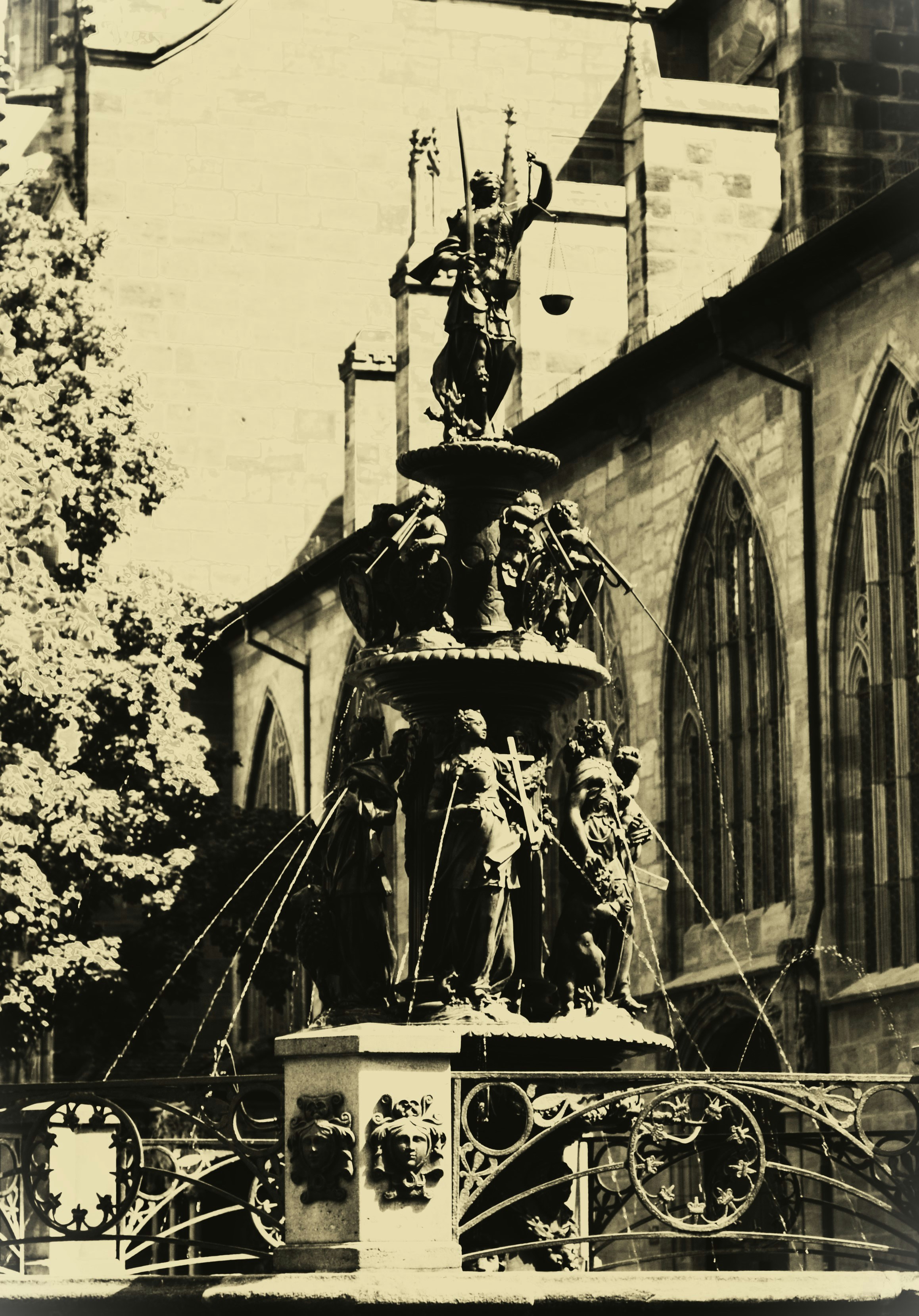 Ornate fountain with equestrian statue and figures.