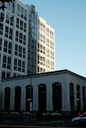 Modern buildings against a clear blue sky.