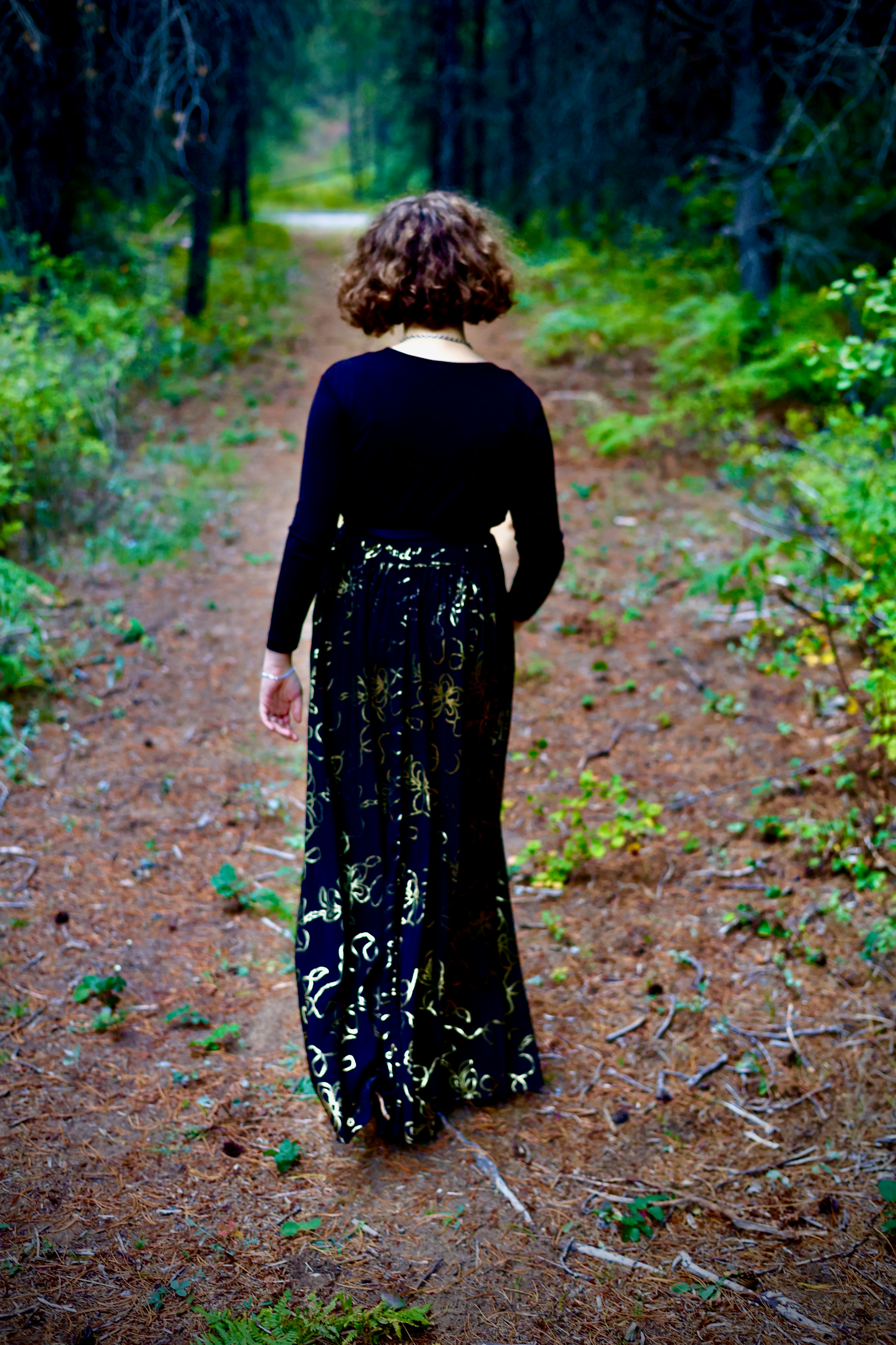 Woman walking on a forest path