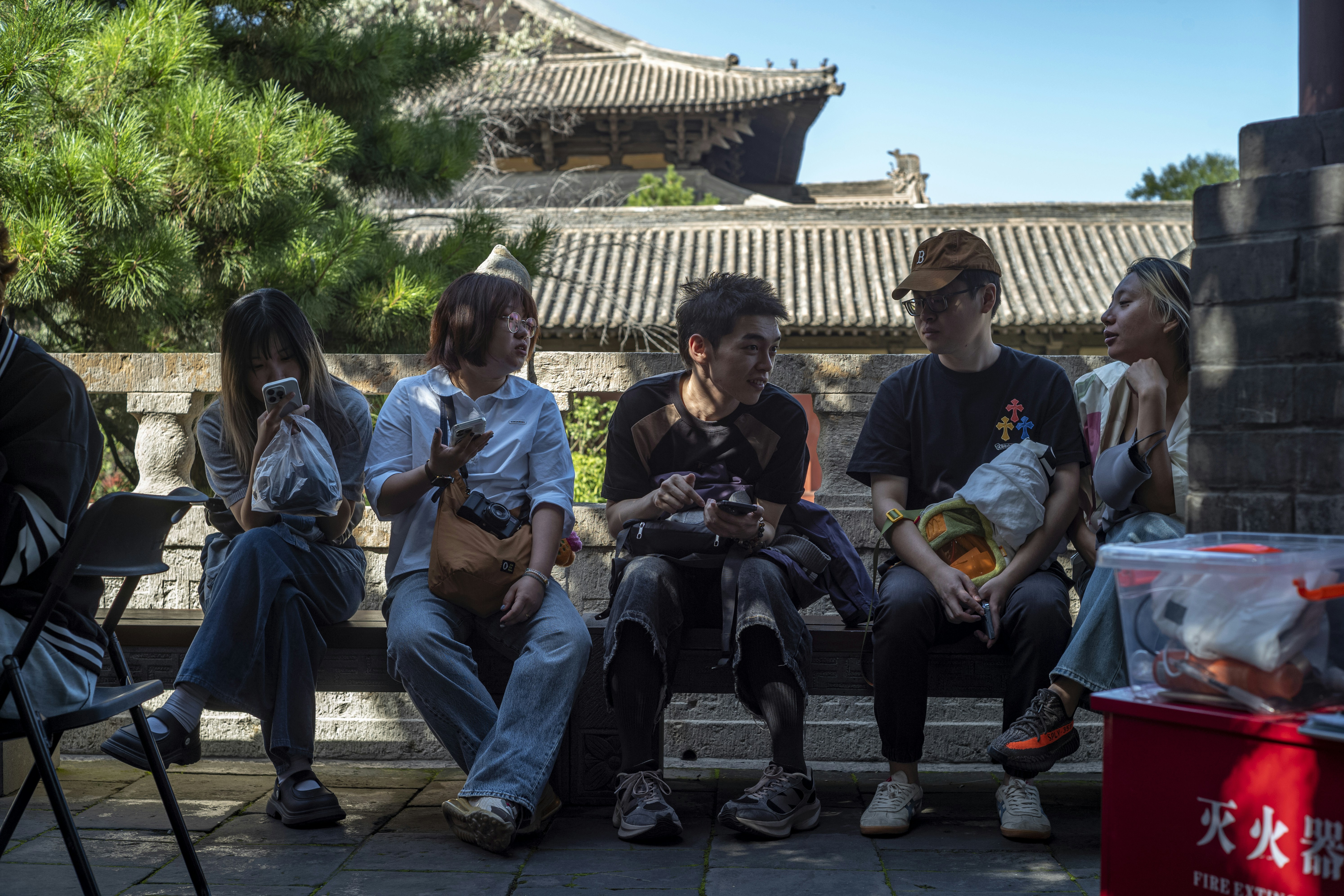 Group of friends sitting together outdoors
