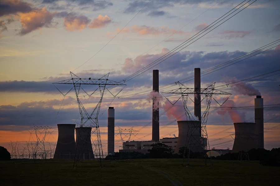 Power plant with cooling towers, representing the ADNOC Volta utilities project