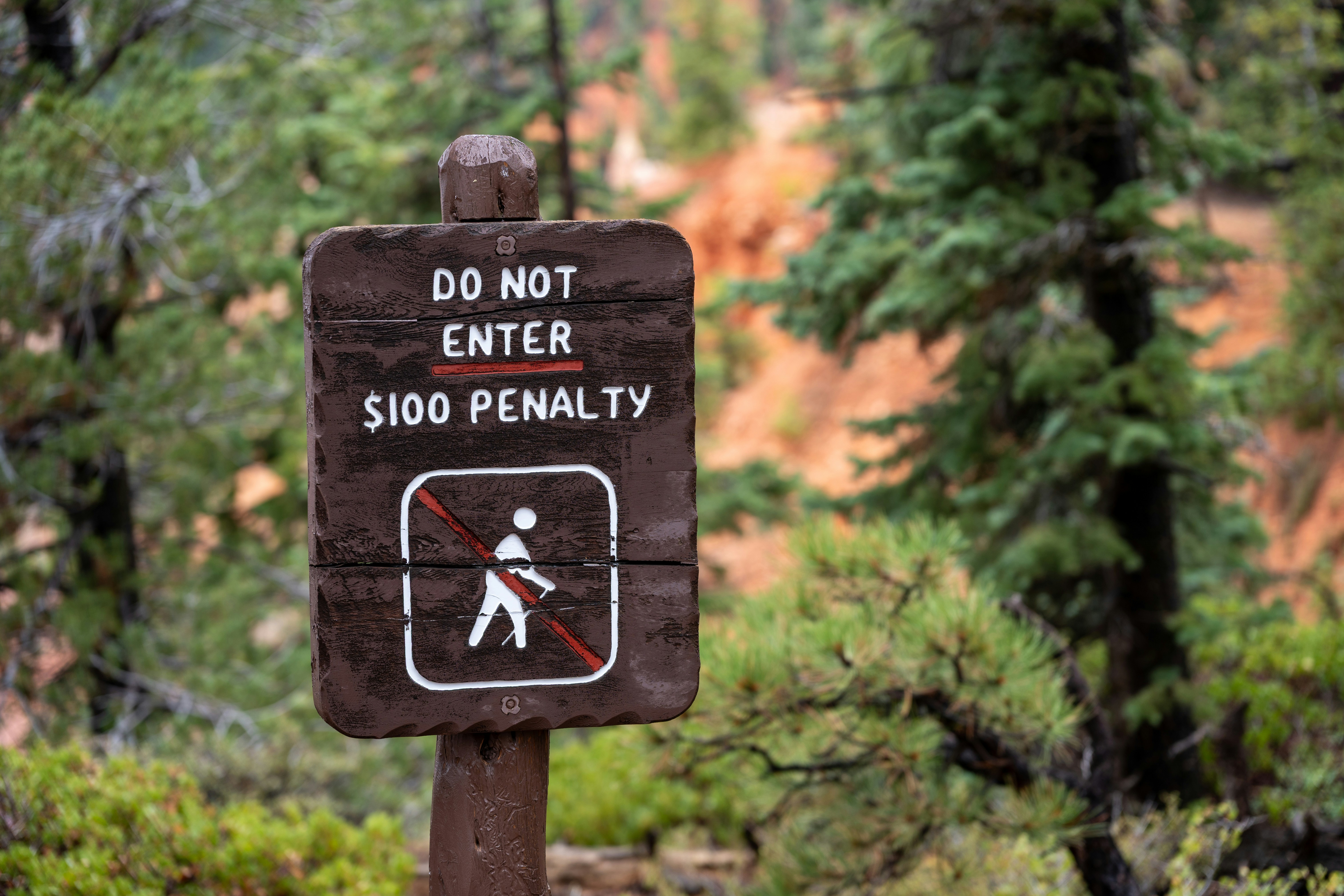 Do not enter sign with $100 penalty warning.