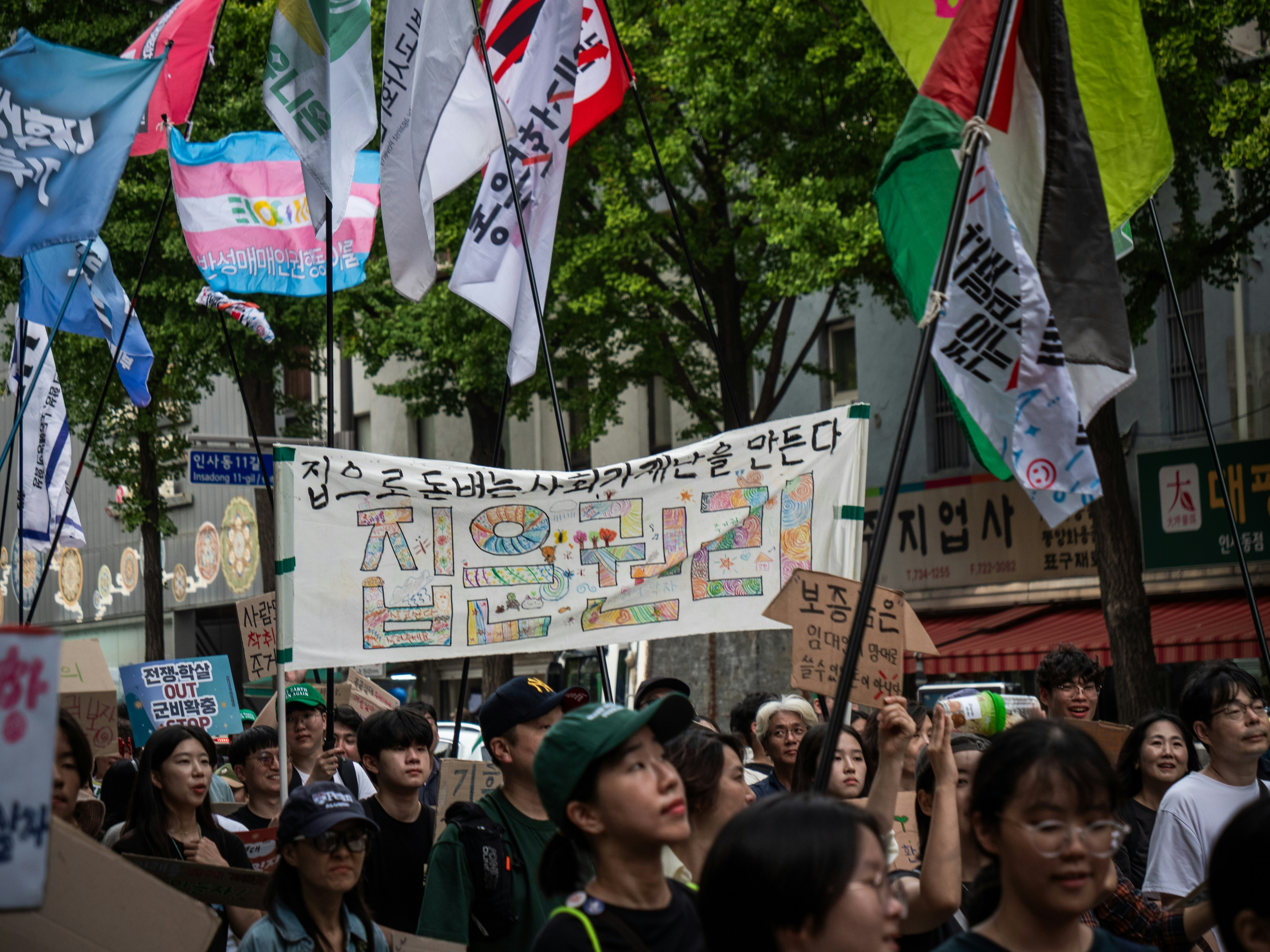 People marching with flags and banners