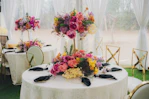 Elegant tables with vibrant floral centerpieces at an event