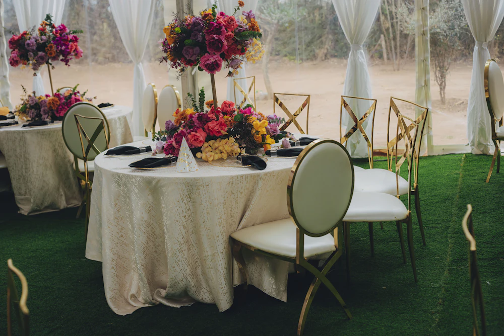 Event tables set with floral arrangements