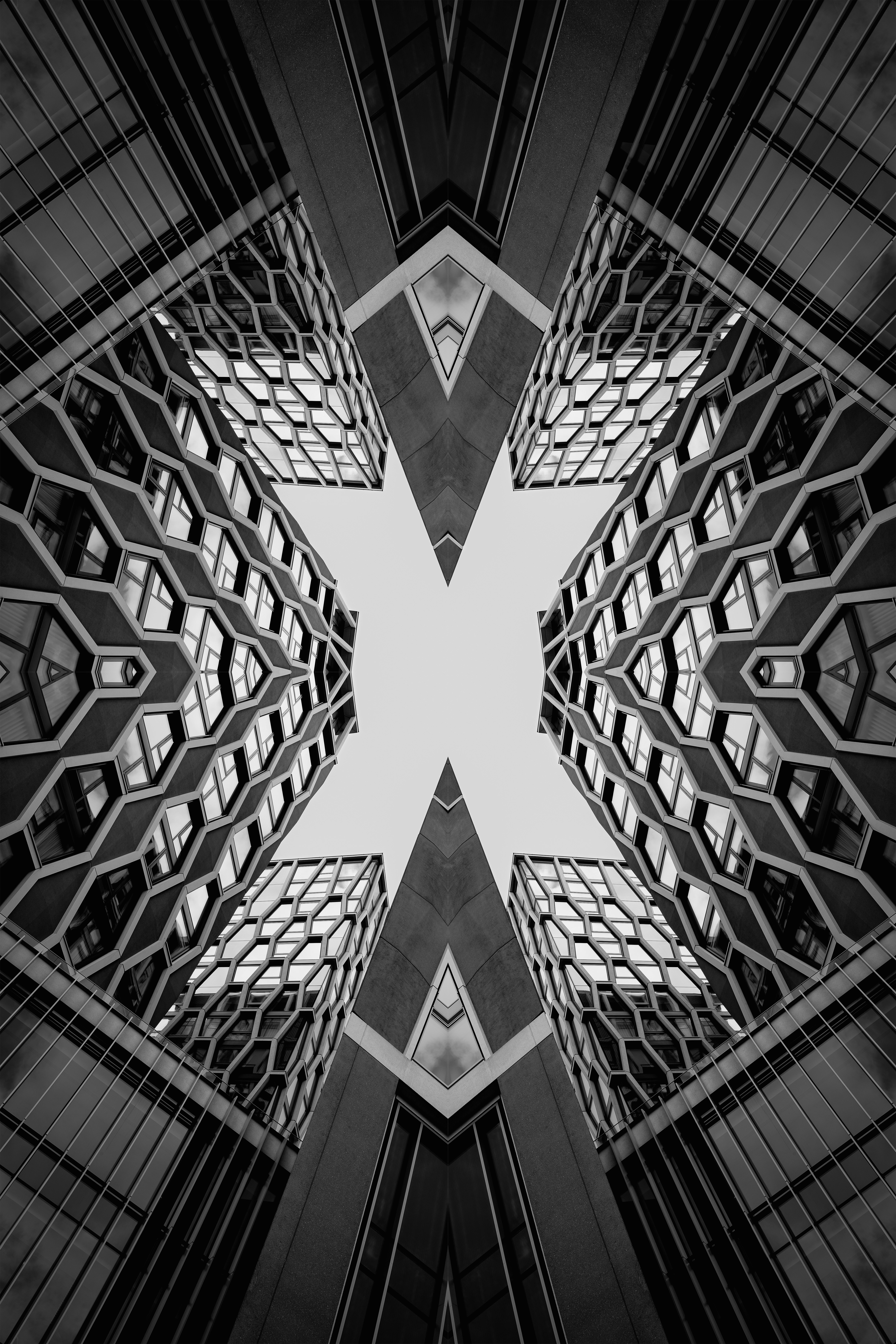 Symmetrical abstract pattern of modern buildings against sky