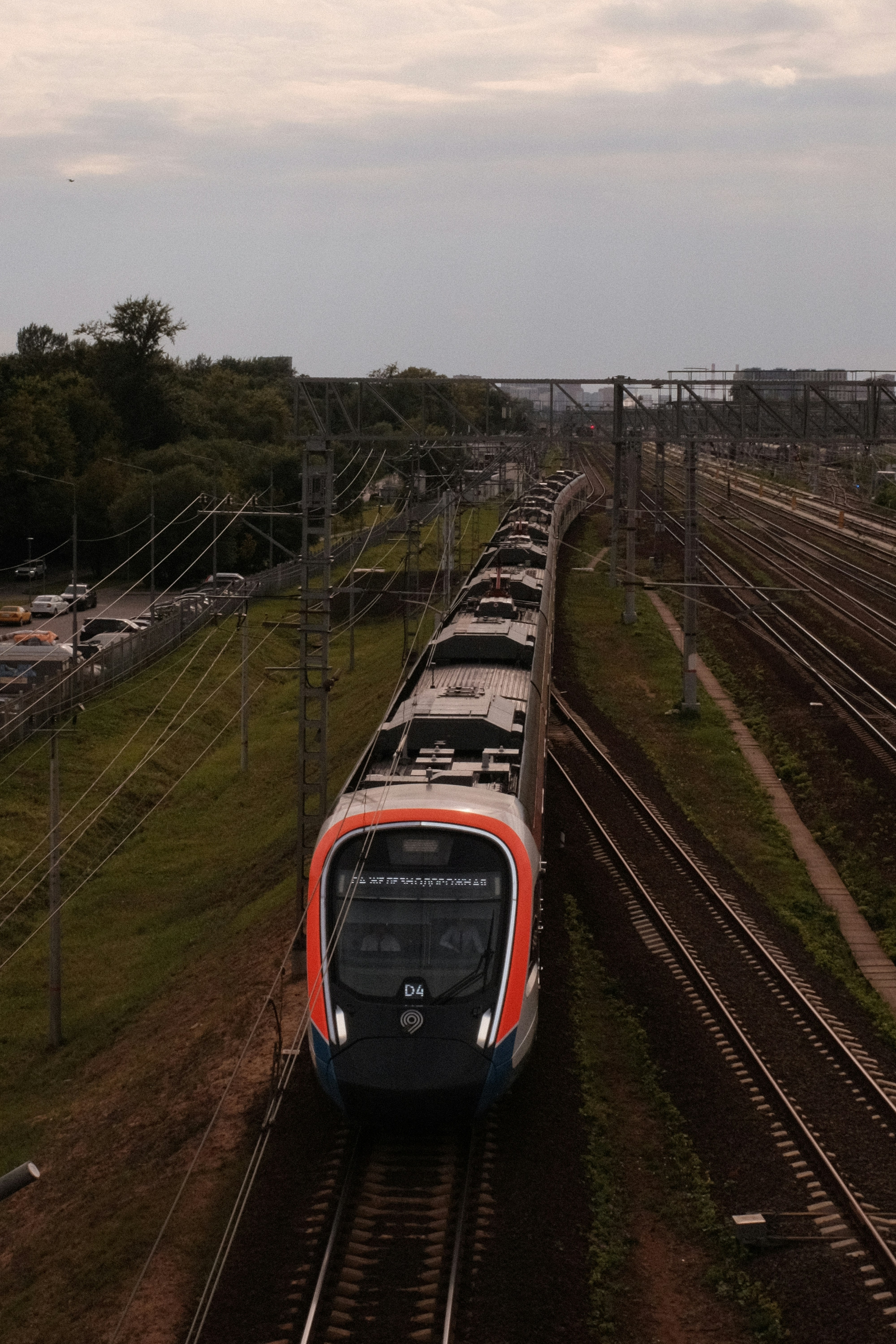 Modern train traveling on railroad tracks