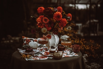 Autumnal table setting with flowers and desserts