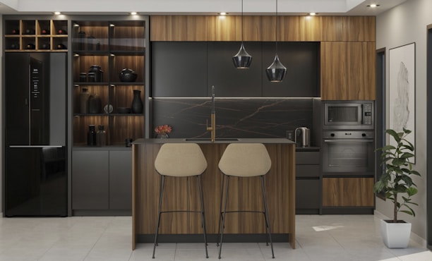 Modern kitchen with island and bar stools.