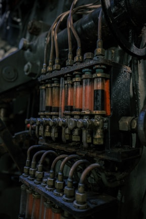 Close-up of an old engine's fuel injection system.