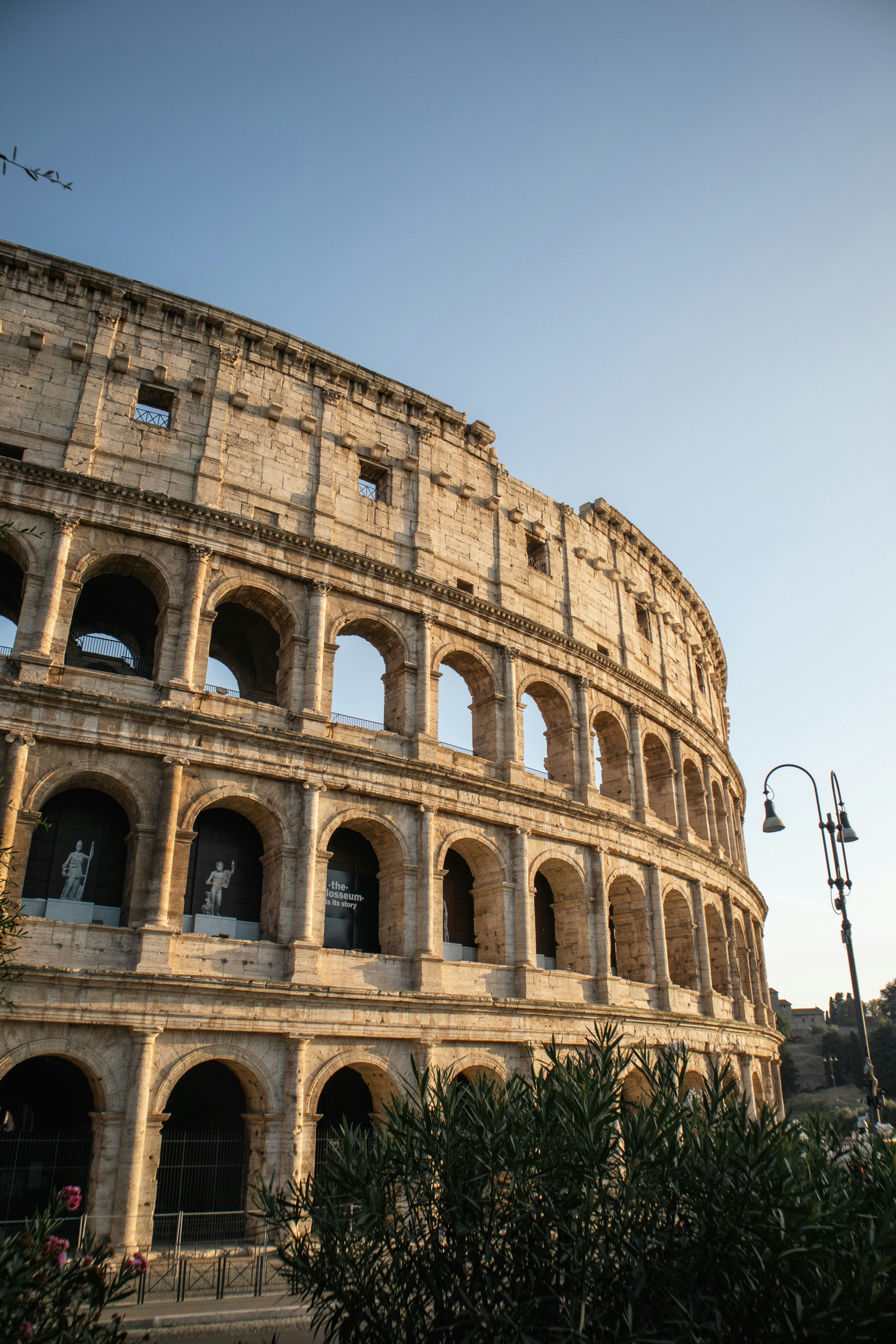 The colosseum in rome under a clear sky