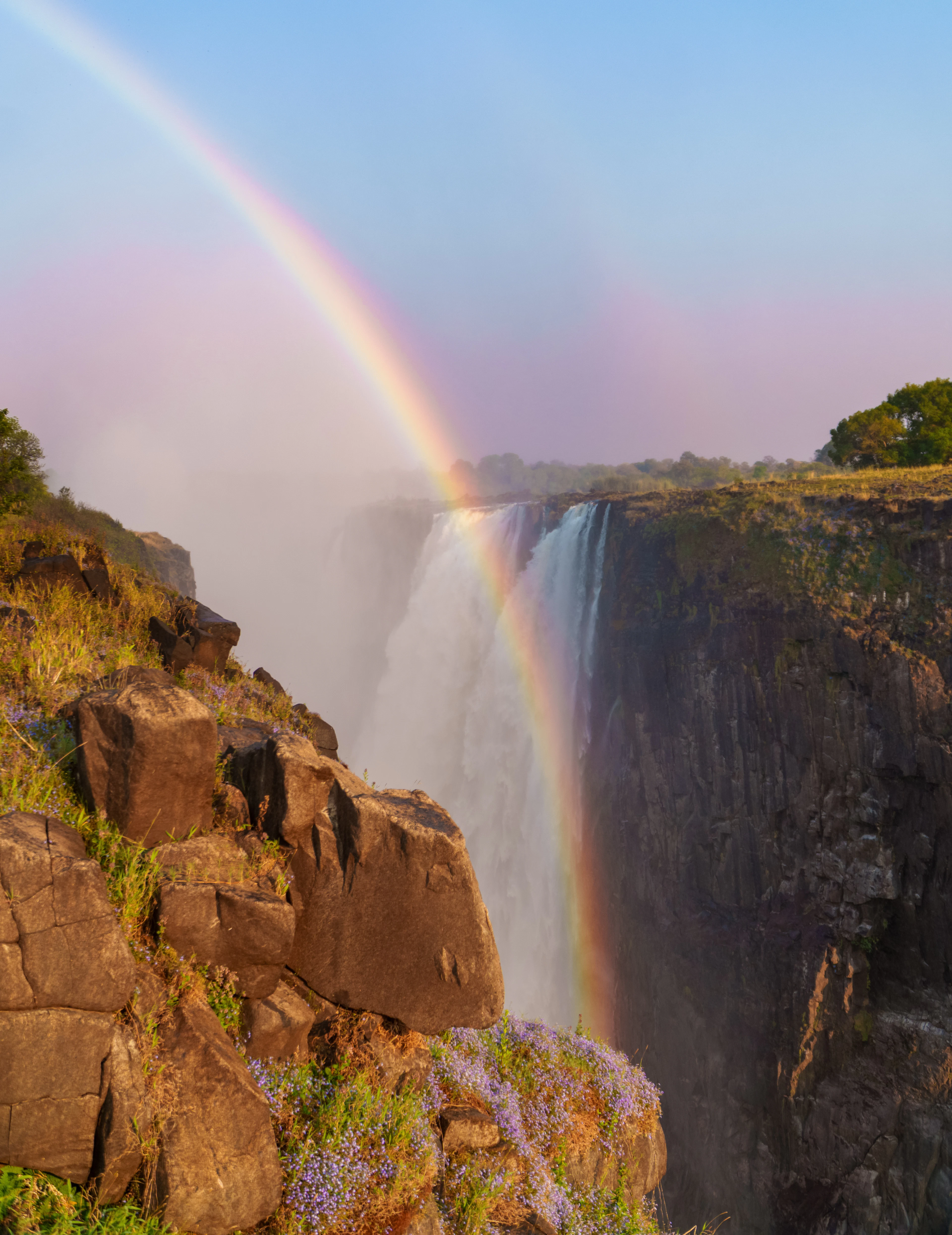 A rainbow standing in the spray of Victoria Falls