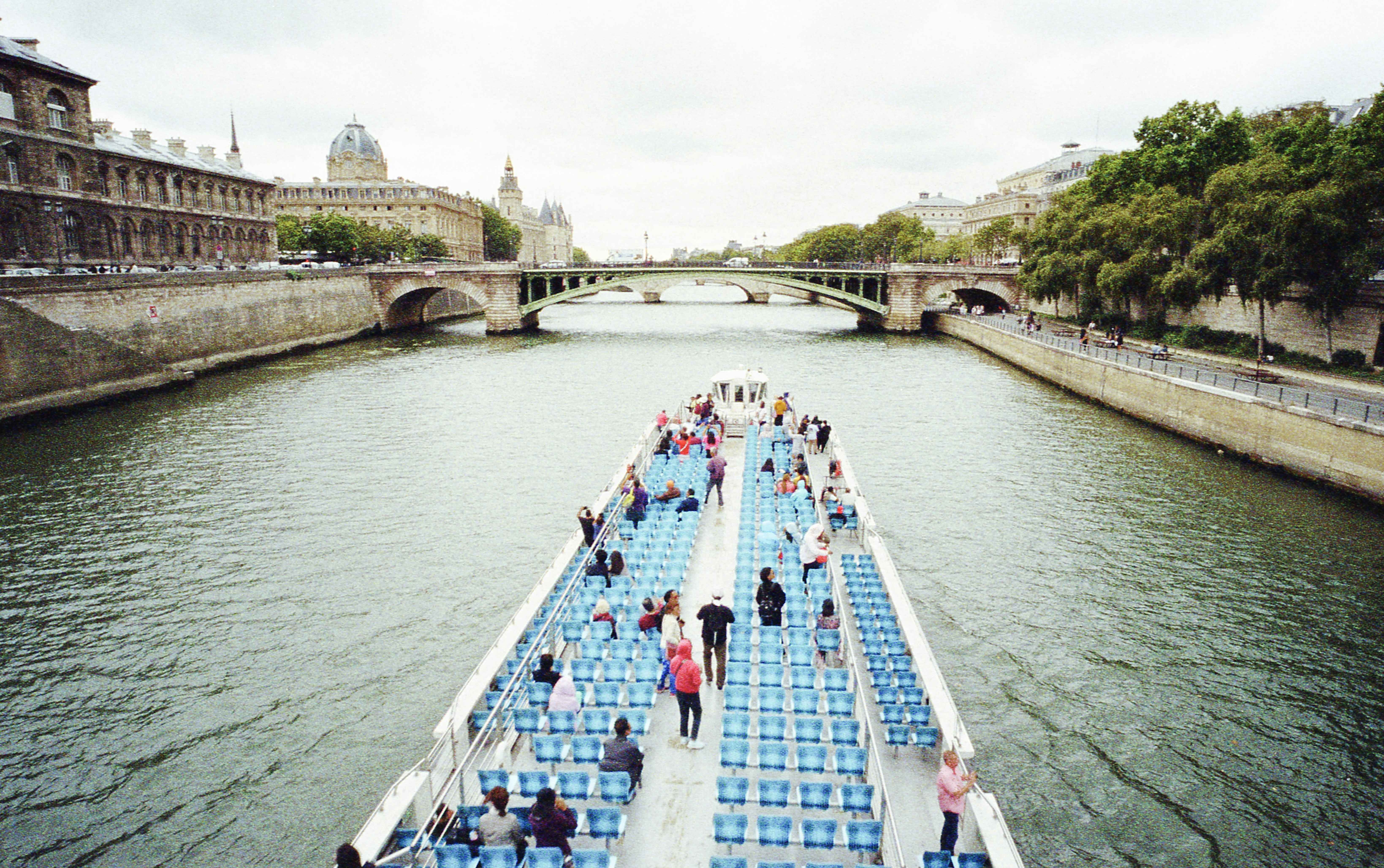 Tour boat cruising along the Seine River in Paris