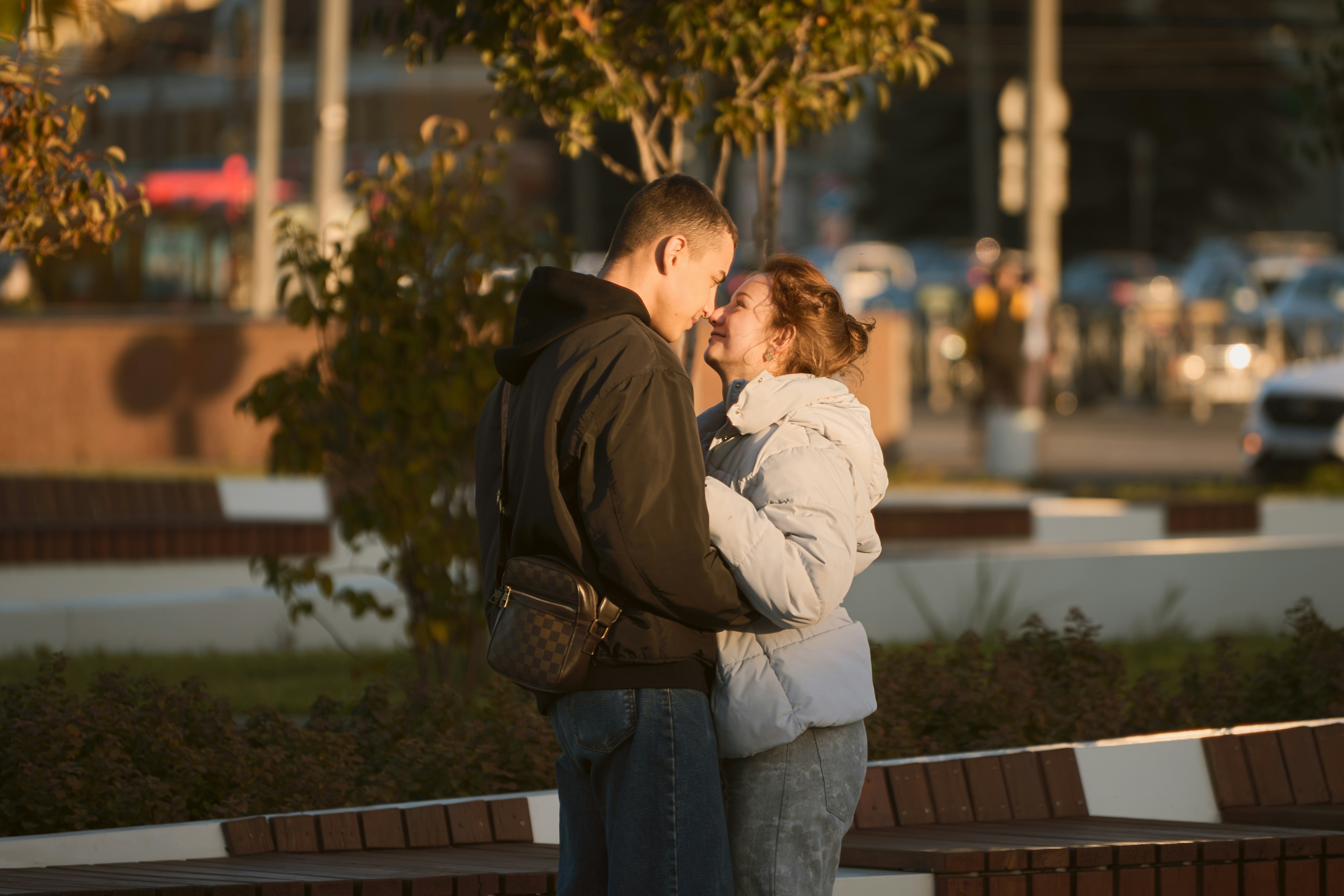 Couple embracing outdoors during daytime