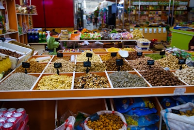 Assortment of dried fruits and nuts at a market stall.