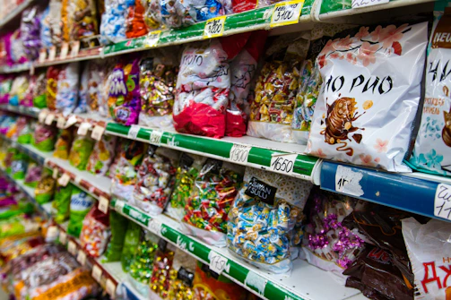Shelves stocked with colorful candy and snacks