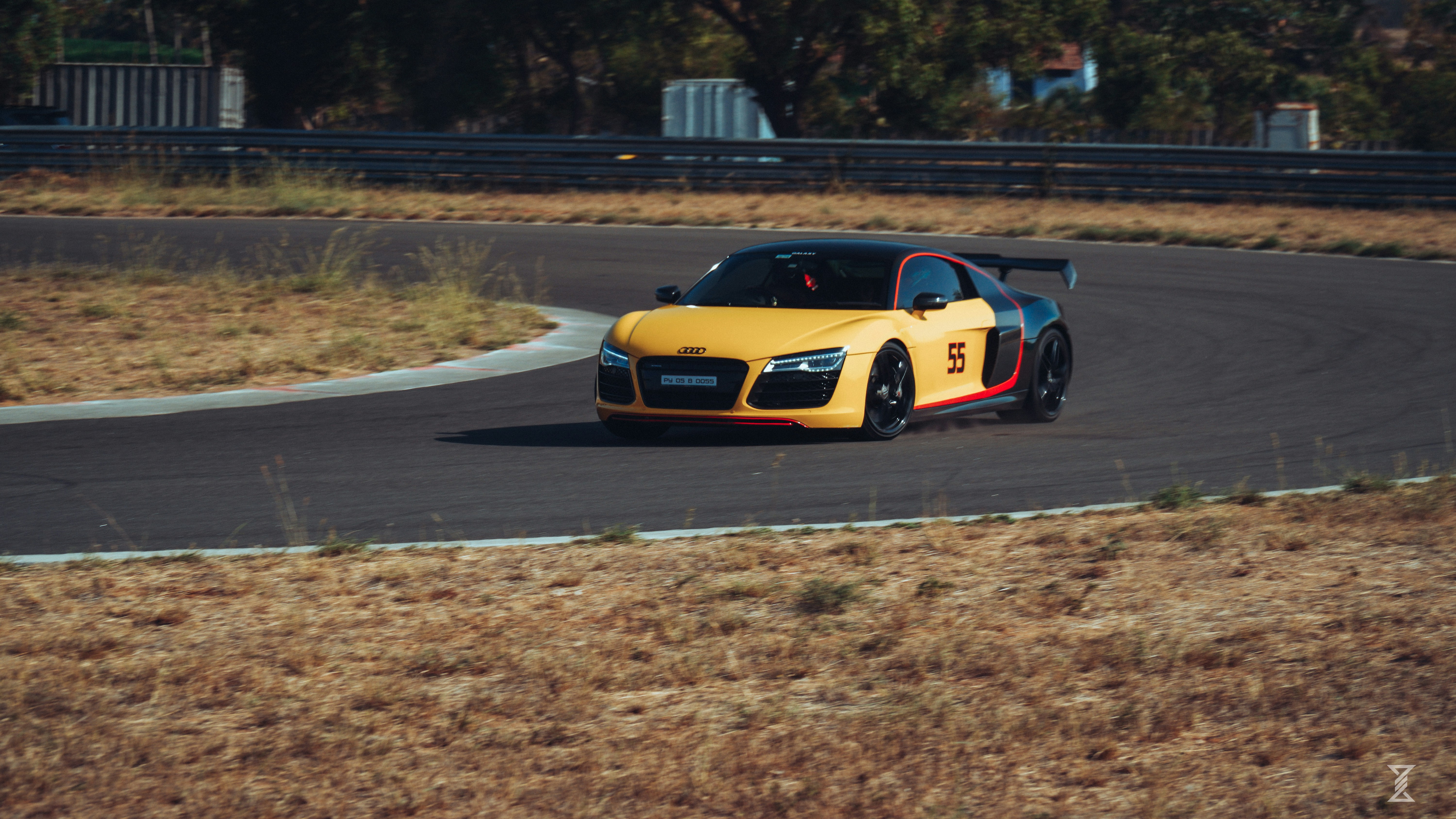 Yellow sports car racing on a track