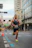 Man running a race on a city street.